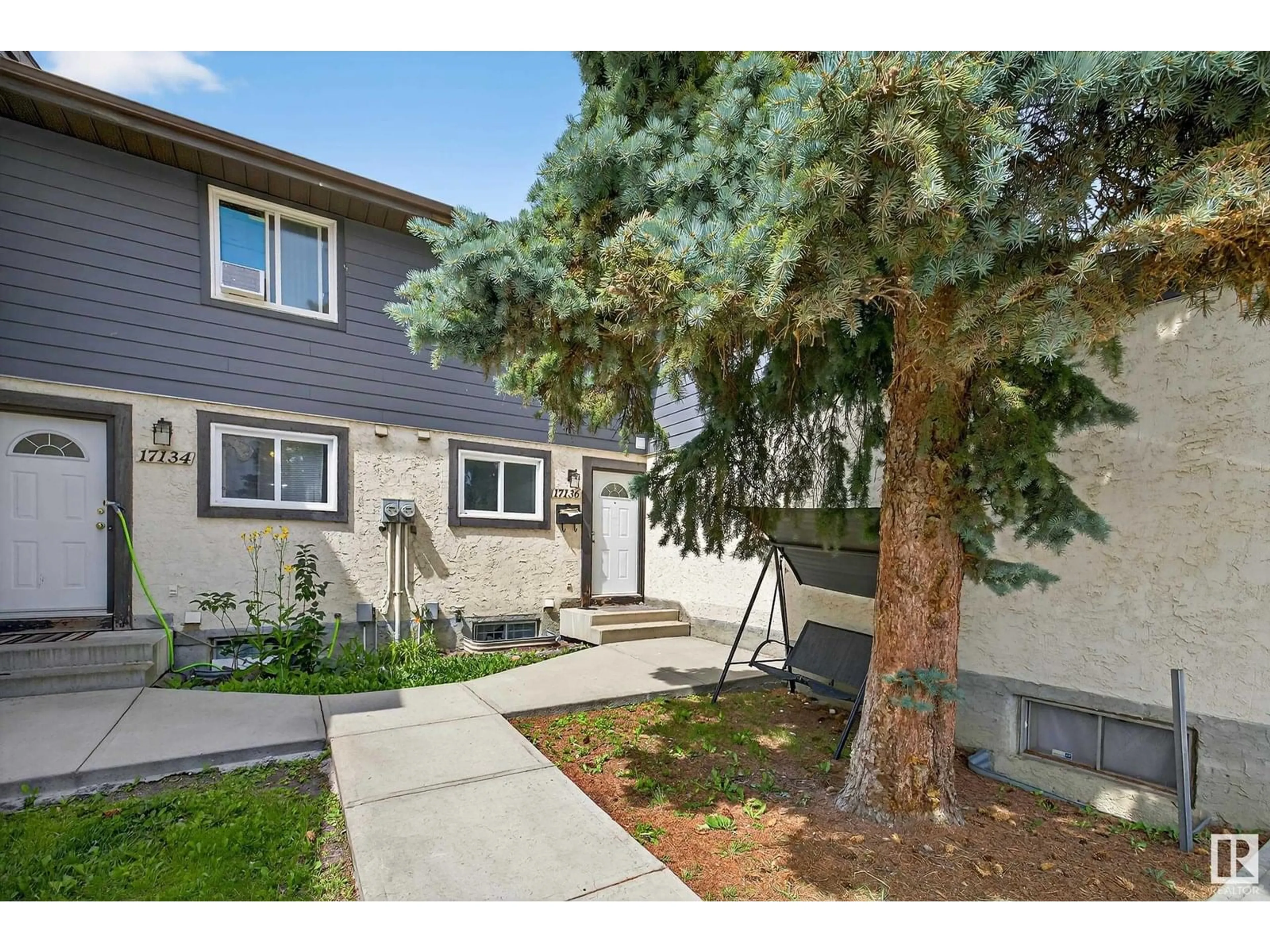Home with vinyl exterior material, street for 17136 100 ST, Edmonton Alberta T5X5H3