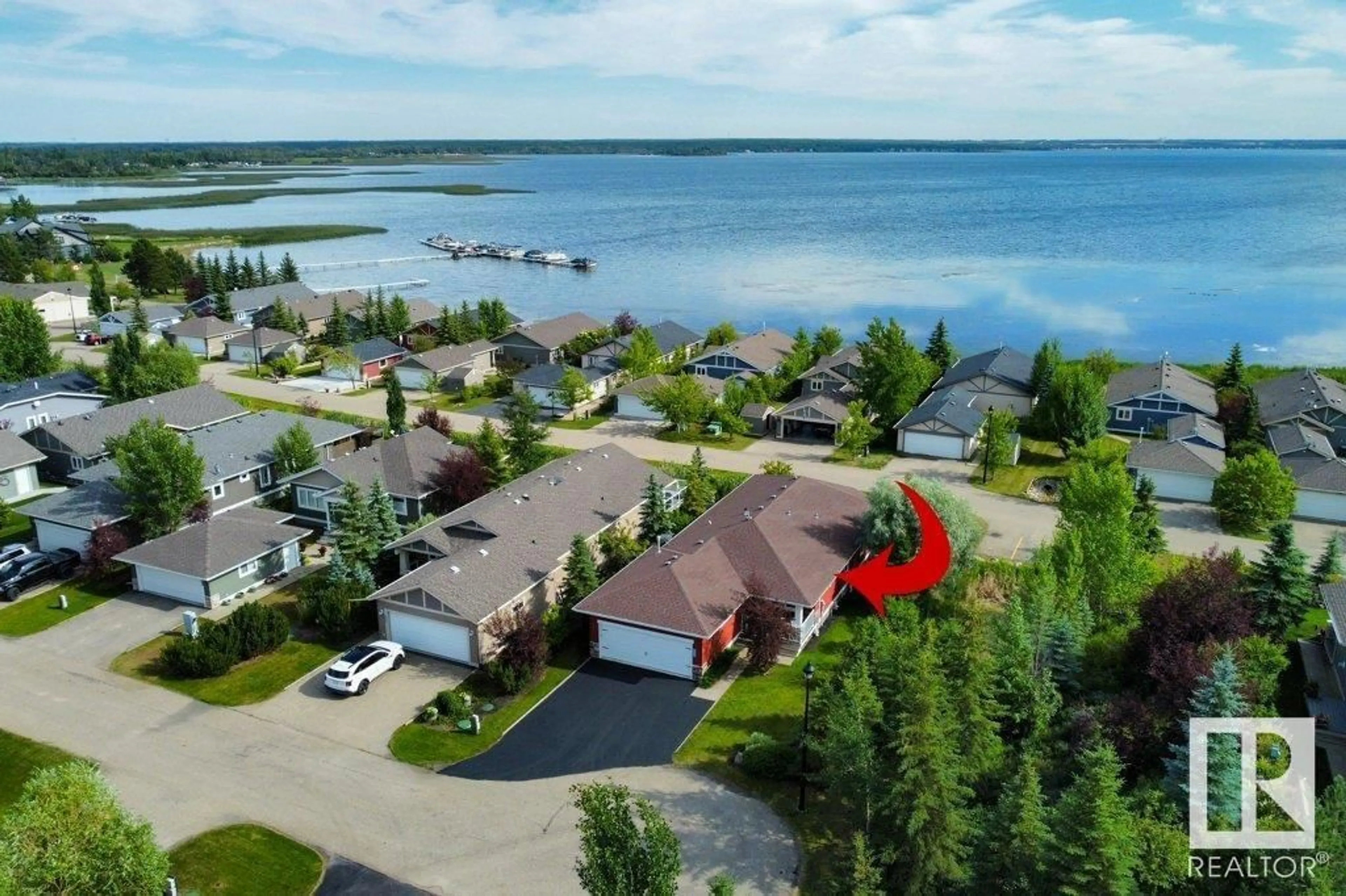 A pic from outside/outdoor area/front of a property/back of a property/a pic from drone, water/lake/river/ocean view for 327 STE. ANNE TR, Rural Lac Ste. Anne County Alberta T0E1A0