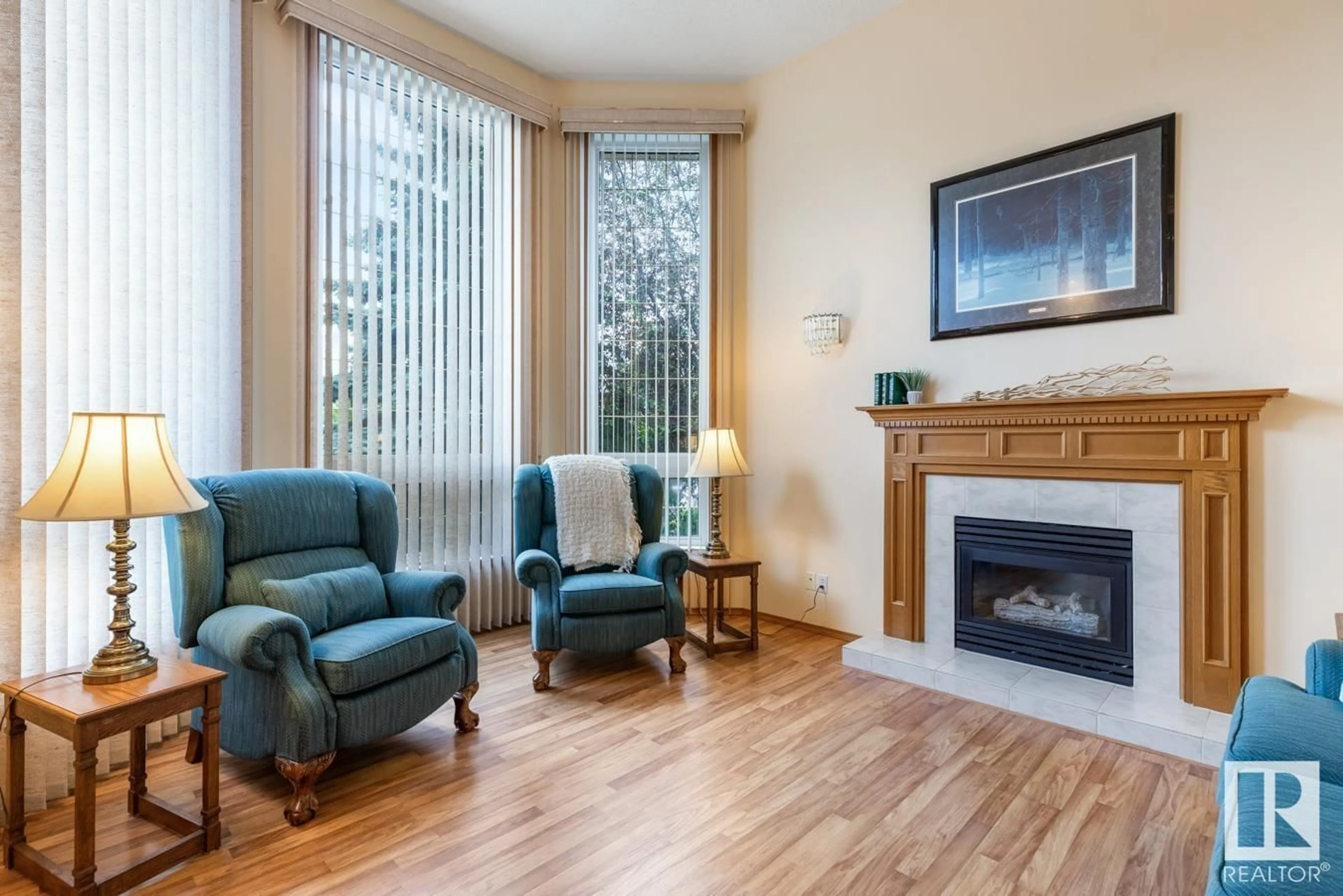 Living room with furniture, wood/laminate floor for 42 COLONIALE WY, Beaumont Alberta T4X1M2
