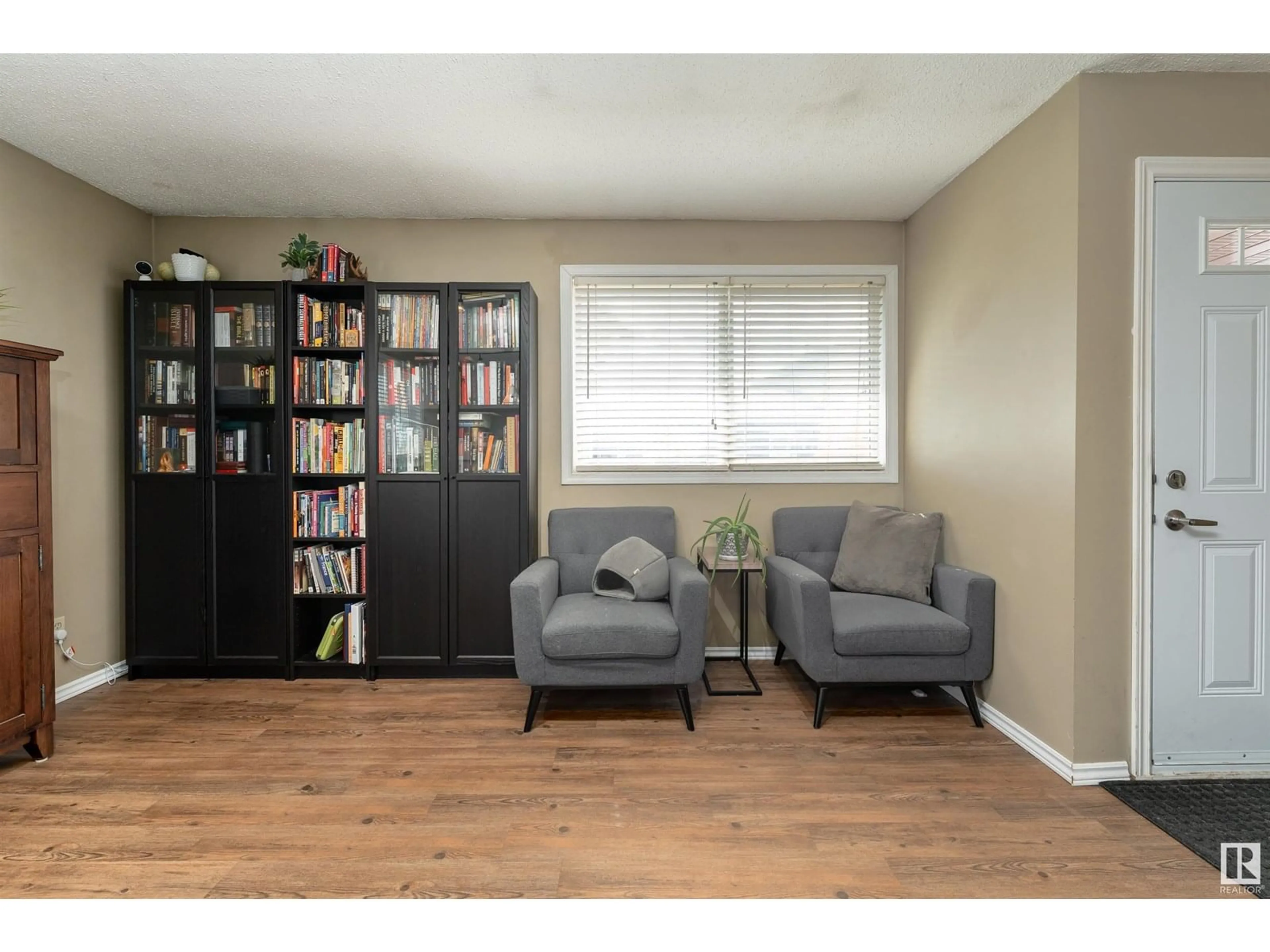Living room with furniture, wood/laminate floor for 118 - 8930 99 AV, Fort Saskatchewan Alberta T8L3L1