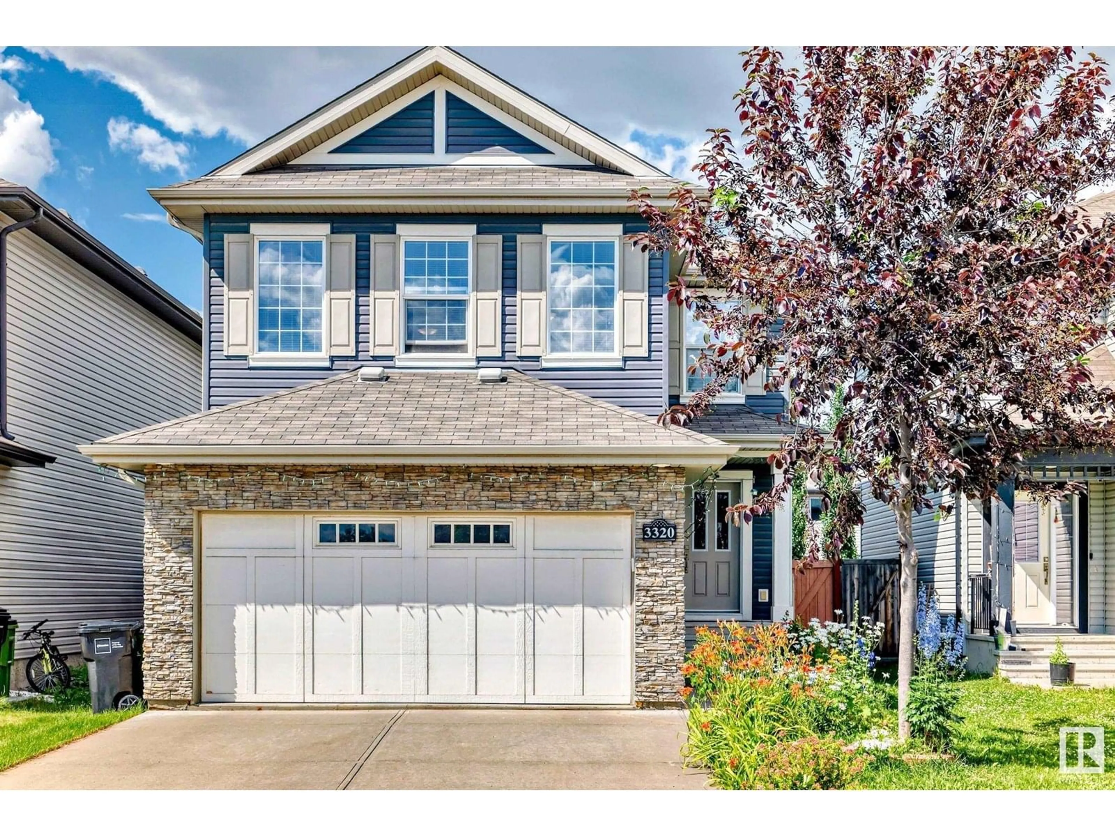 Home with vinyl exterior material, street for 3320 20 AV, Edmonton Alberta T6T0L4