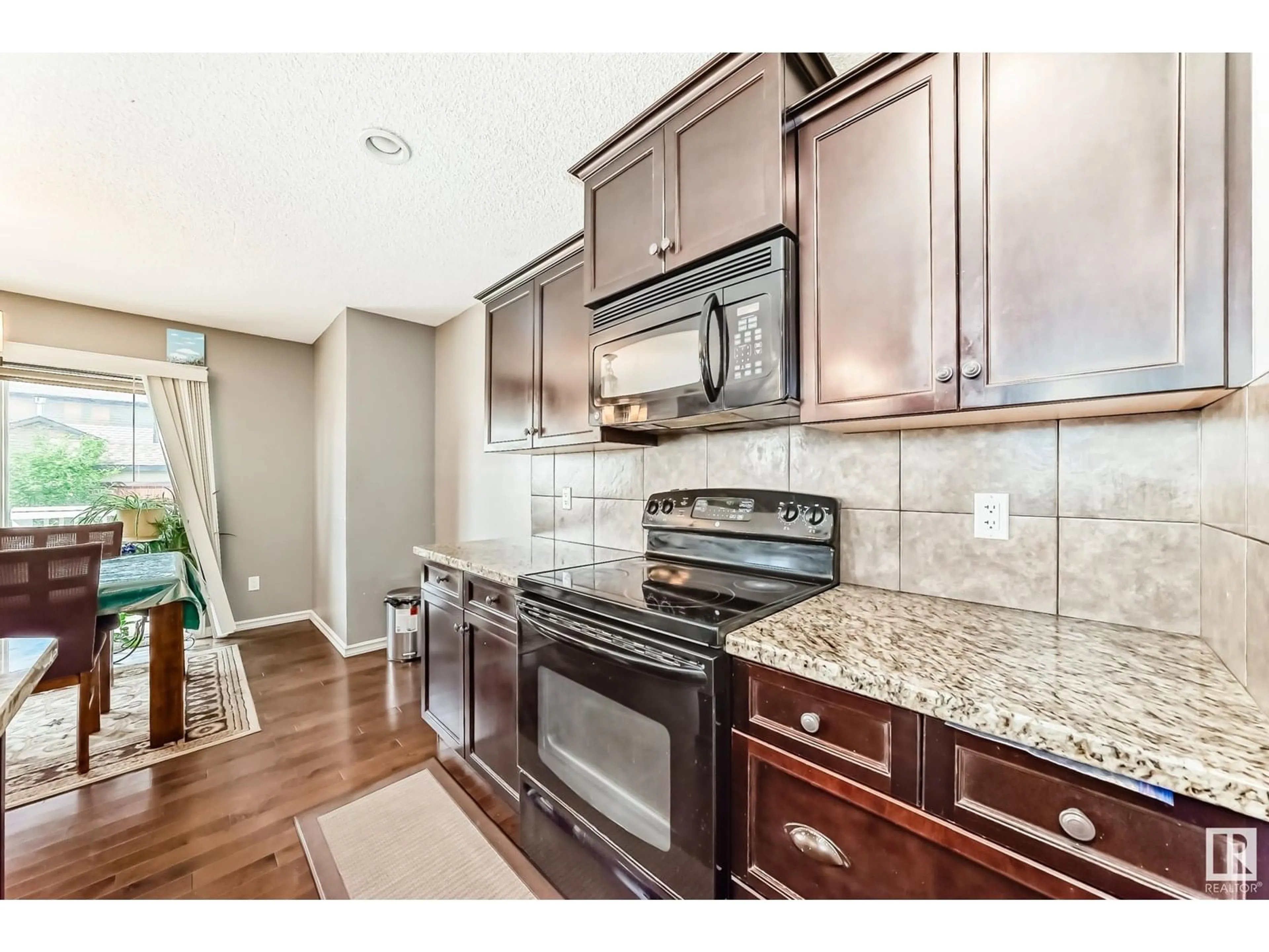 Open concept kitchen, ceramic/tile floor for 3320 20 AV, Edmonton Alberta T6T0L4