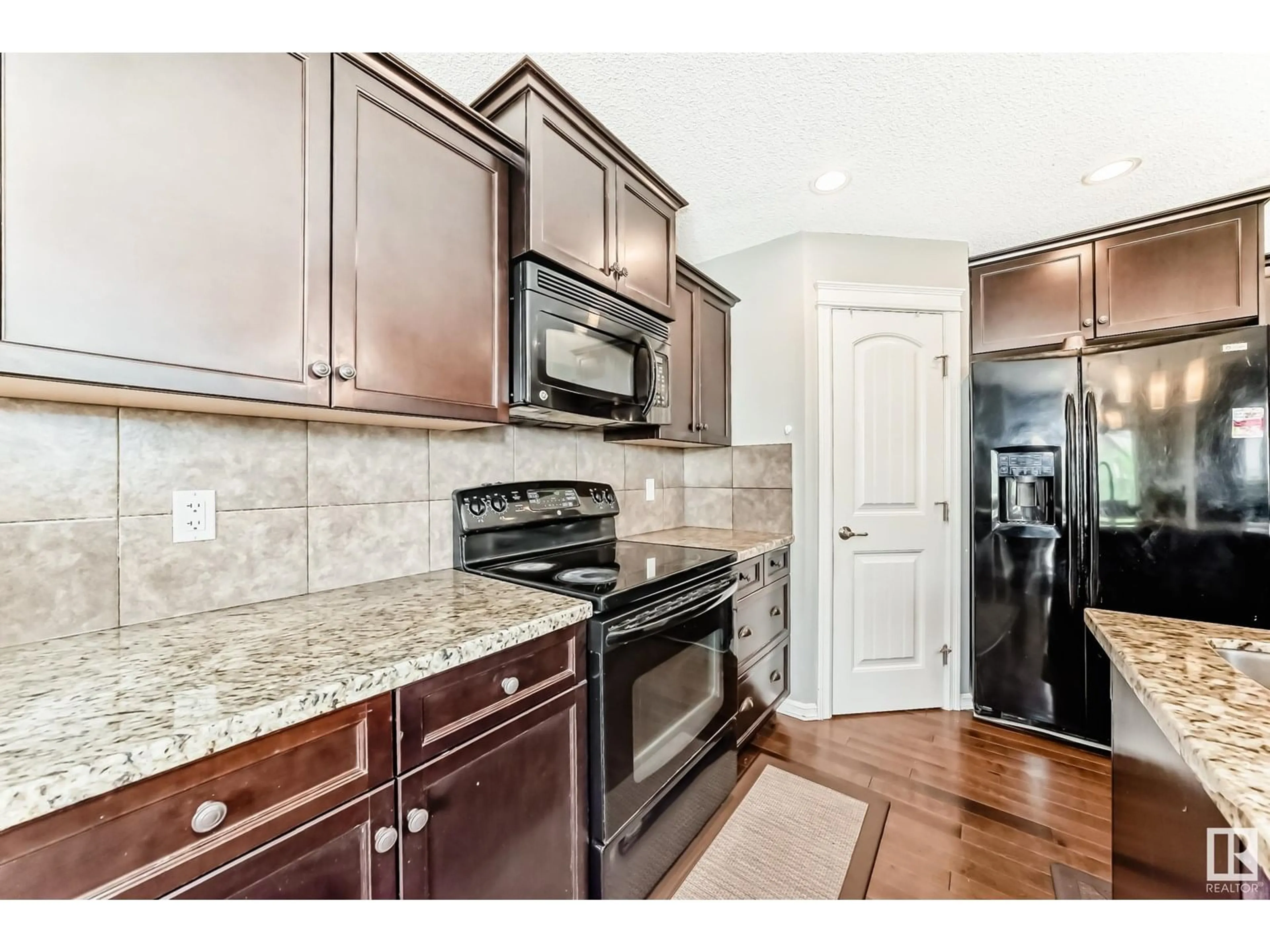 Open concept kitchen, ceramic/tile floor for 3320 20 AV, Edmonton Alberta T6T0L4