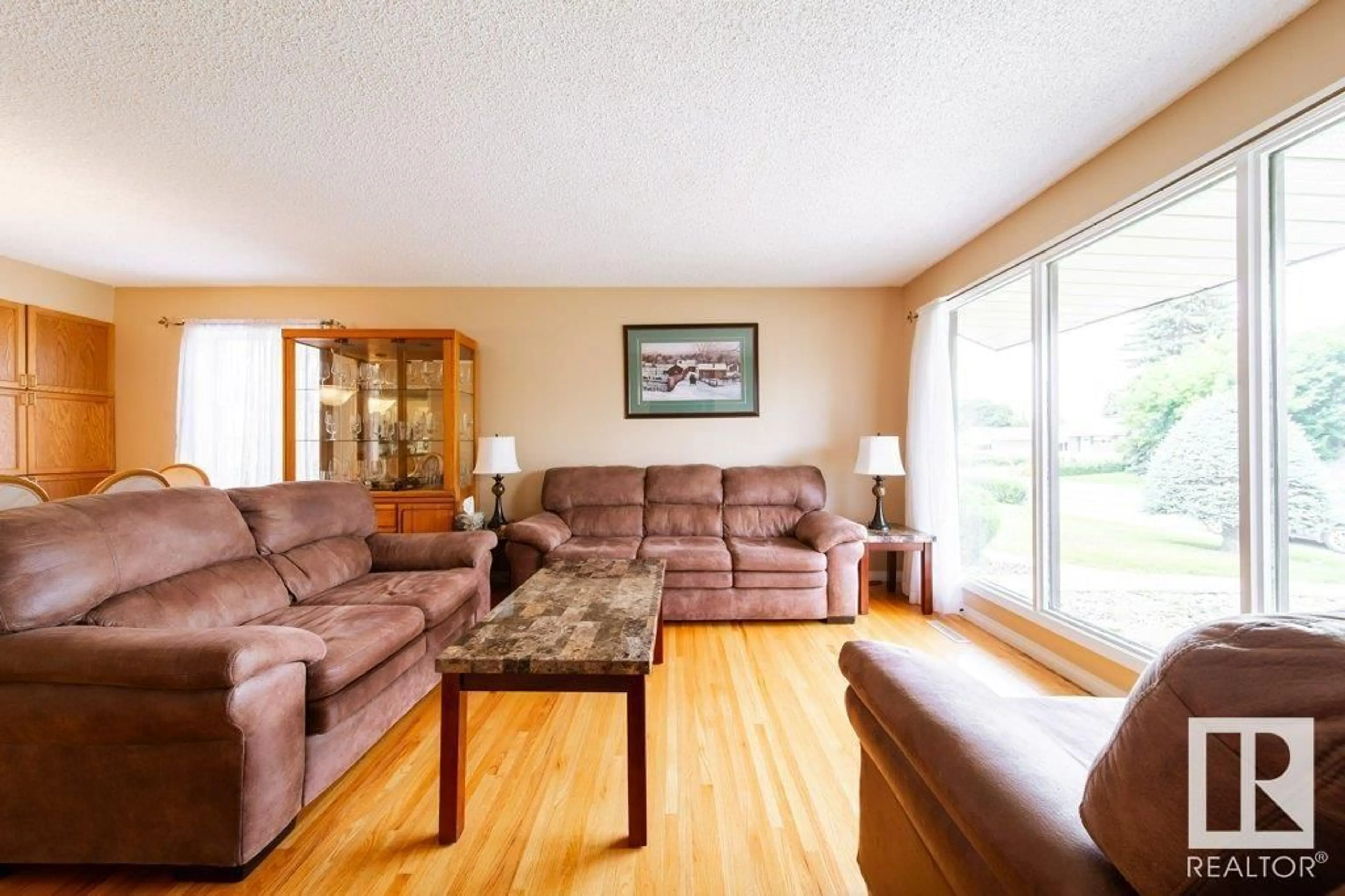 Living room with furniture, wood/laminate floor for NW - 15629 83 AV, Edmonton Alberta T5R3T6