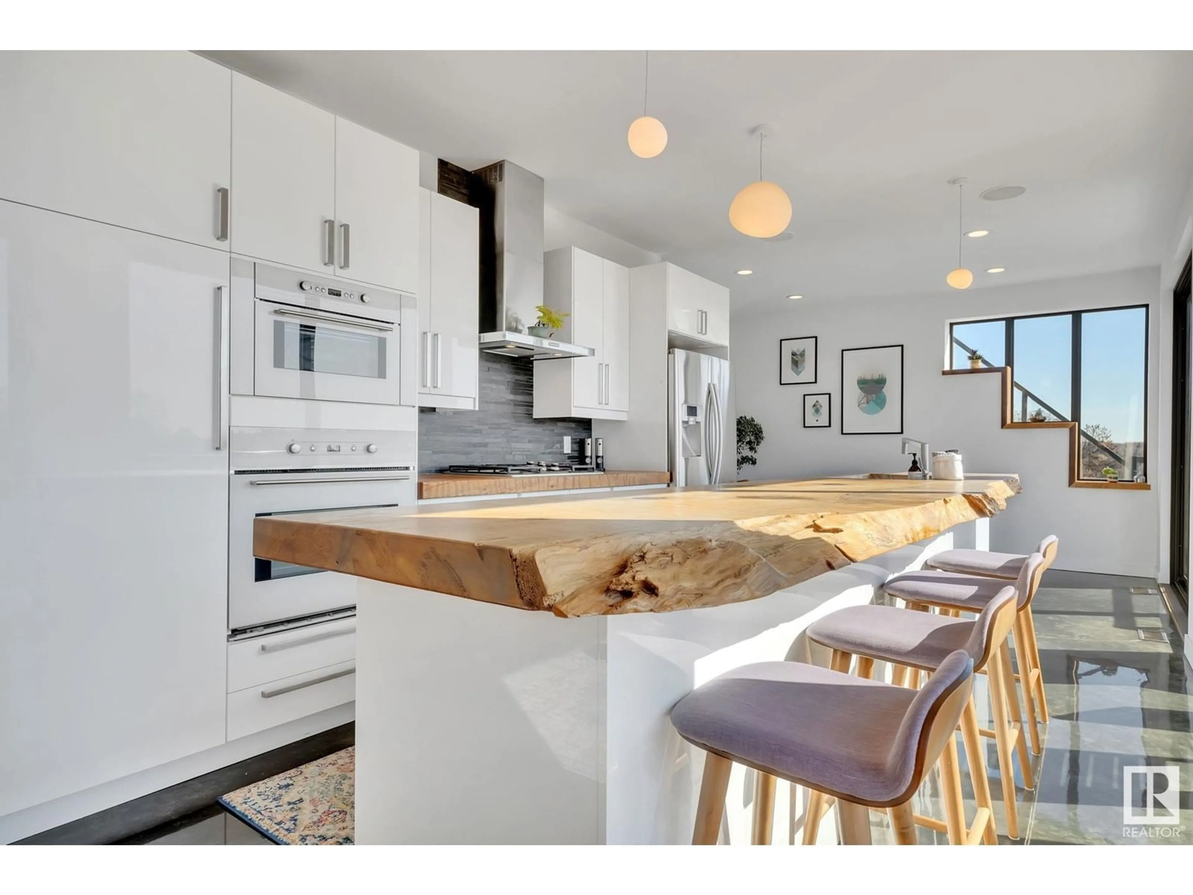 Open concept kitchen, wood/laminate floor for 9457 100A AV, Edmonton Alberta T5H0A6
