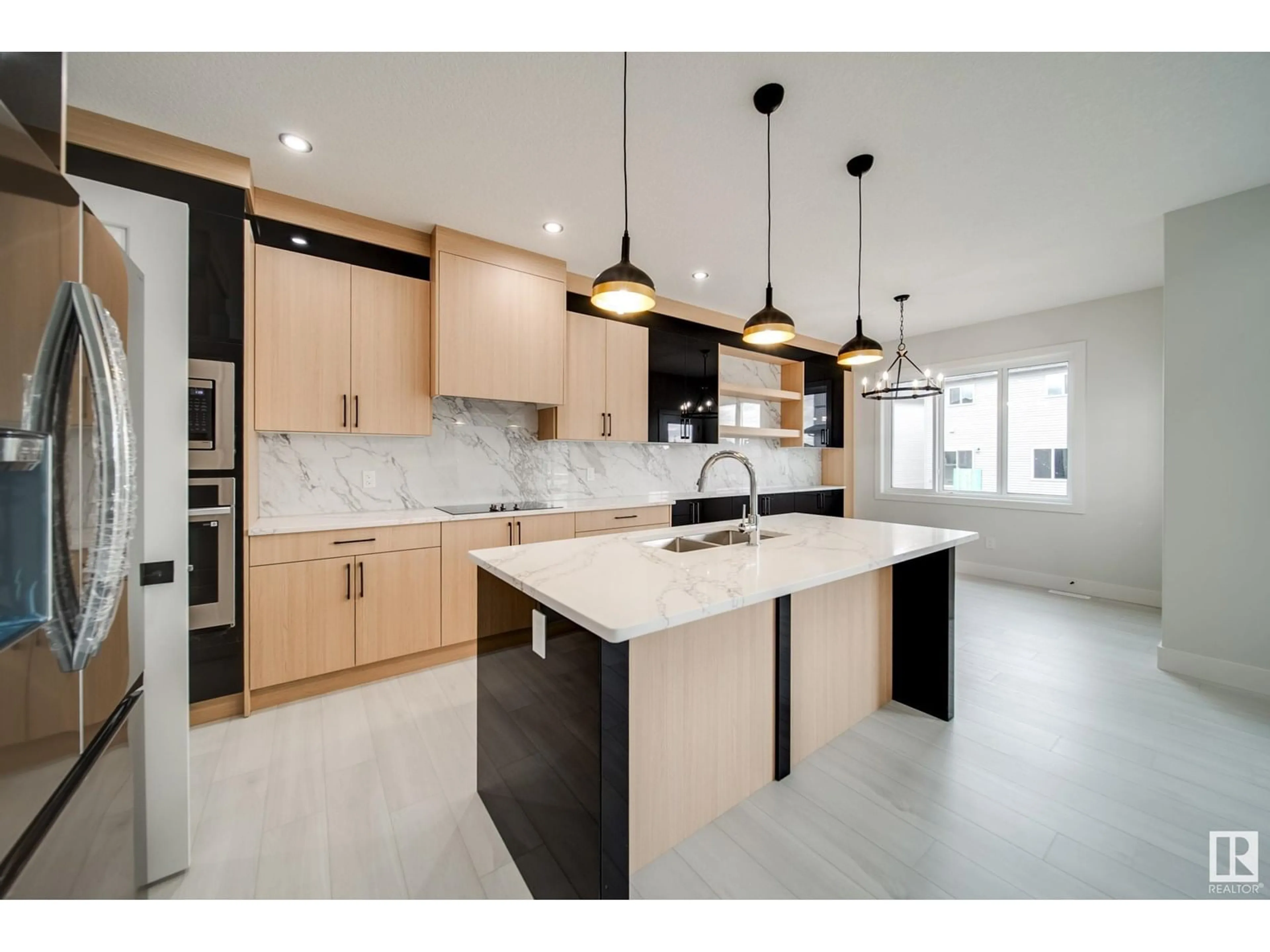 Open concept kitchen, ceramic/tile floor for 8811 183 AV, Edmonton Alberta T5Z0S8