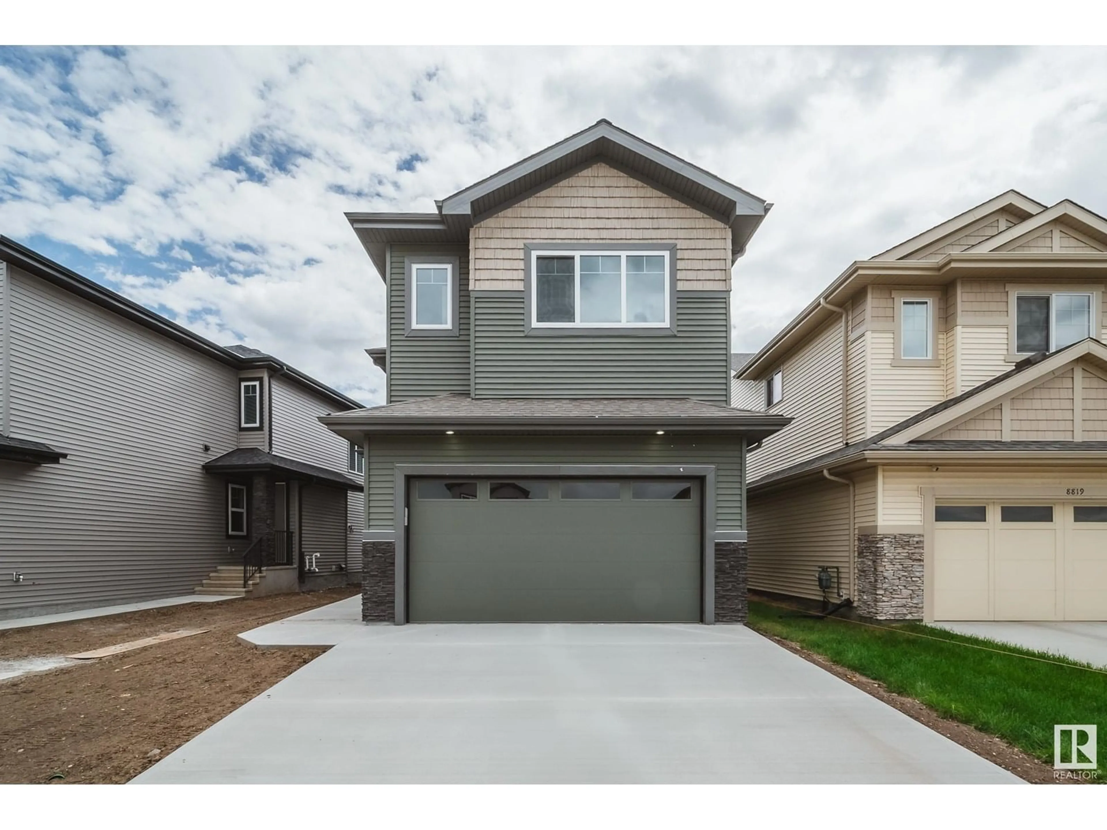 Home with vinyl exterior material, street for 8815 183 AV, Edmonton Alberta T5Z0S8