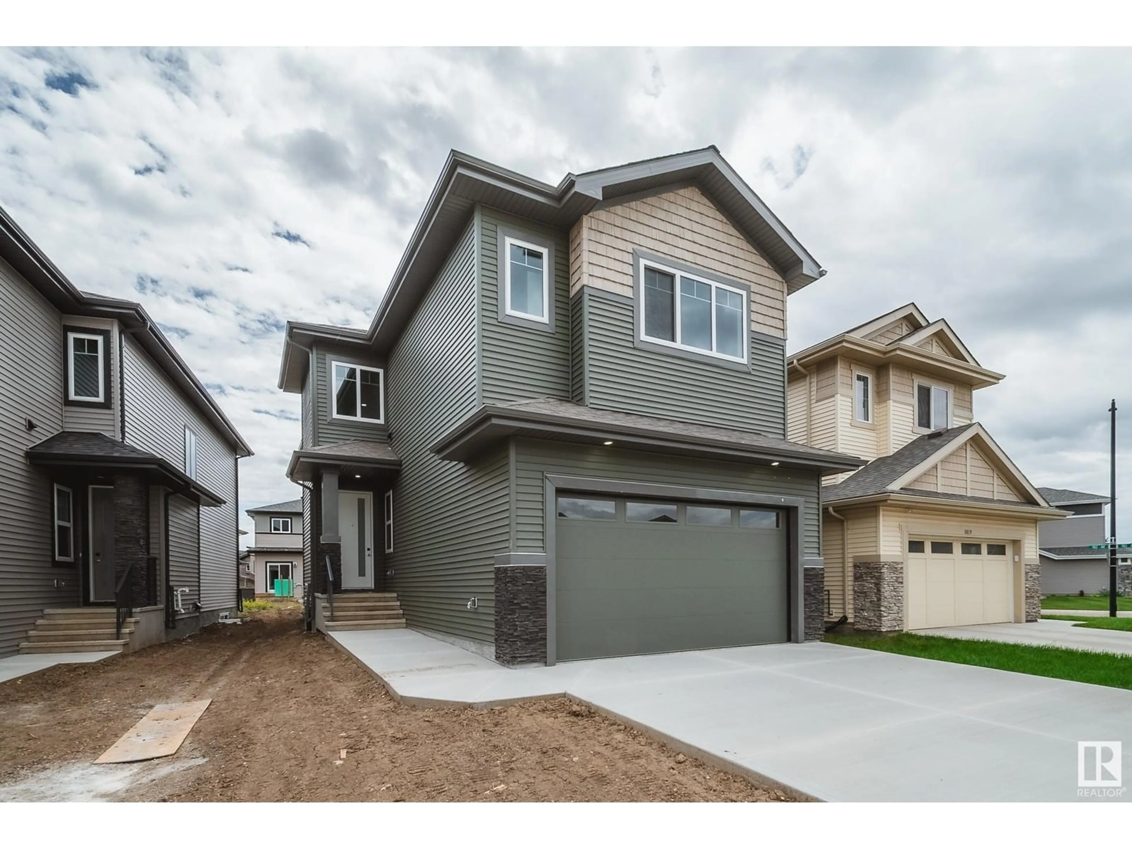Home with vinyl exterior material, street for 8815 183 AV, Edmonton Alberta T5Z0S8