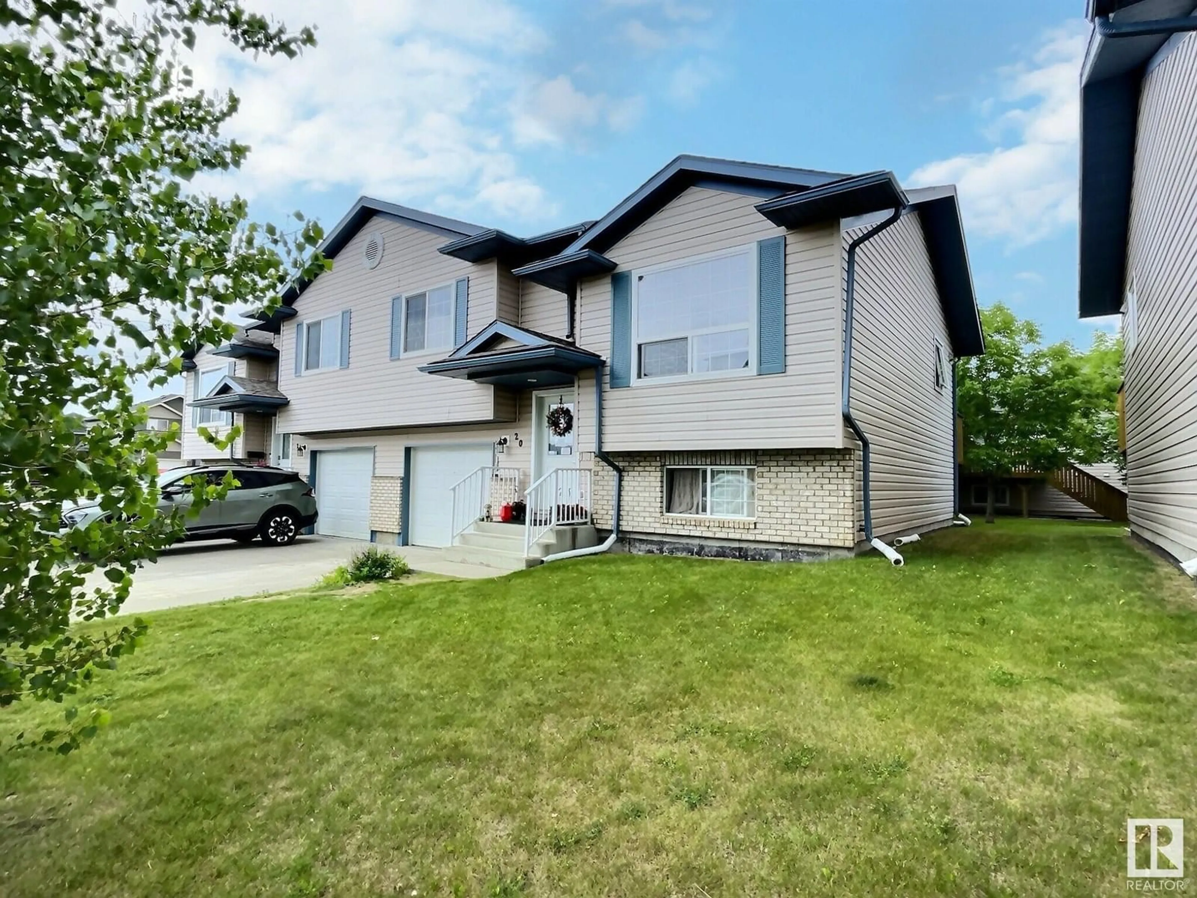 Home with vinyl exterior material, street for 20 6506 47 ST, Cold Lake Alberta T9M0C5