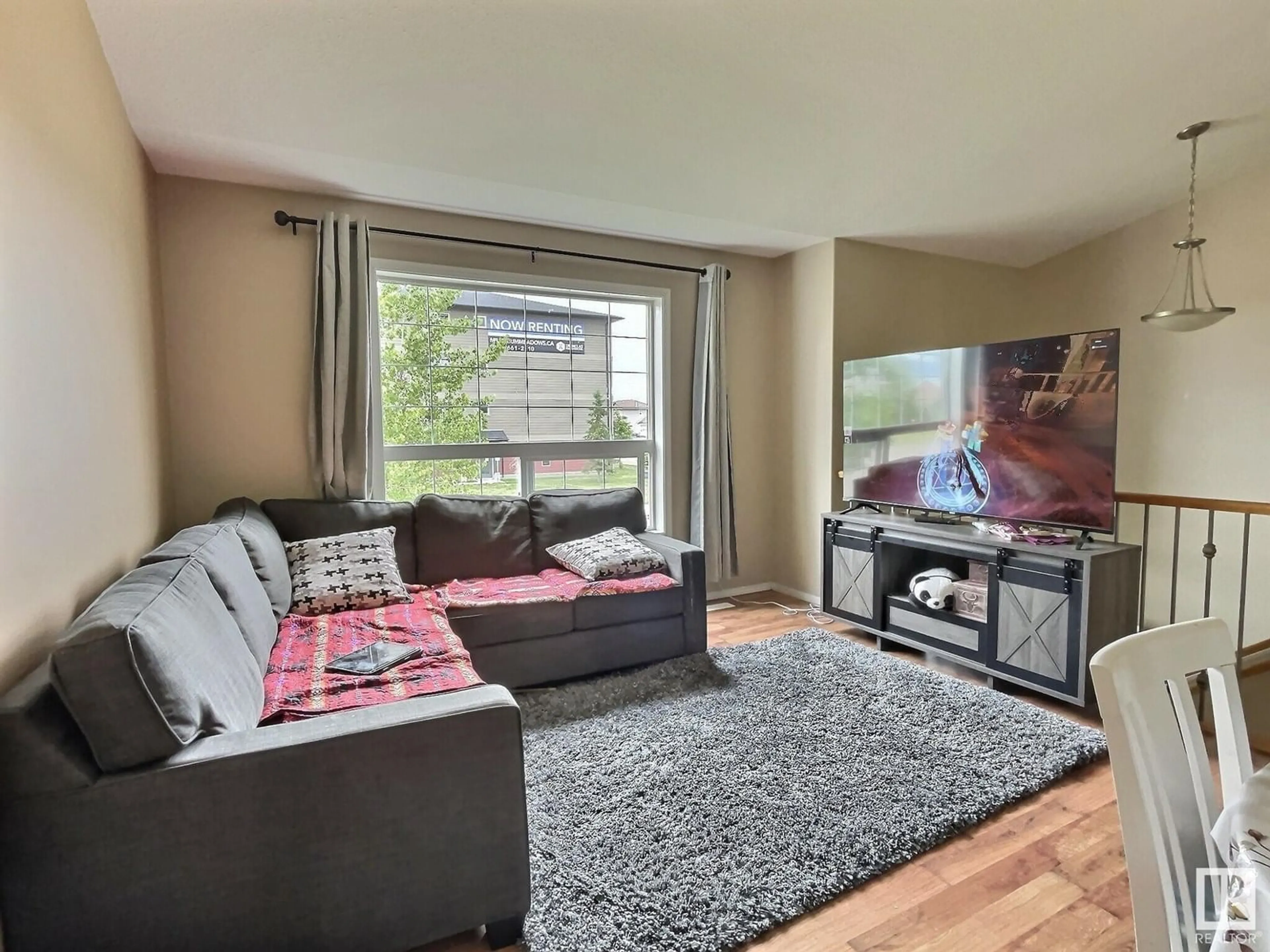Living room with furniture, wood/laminate floor for 20 6506 47 ST, Cold Lake Alberta T9M0C5