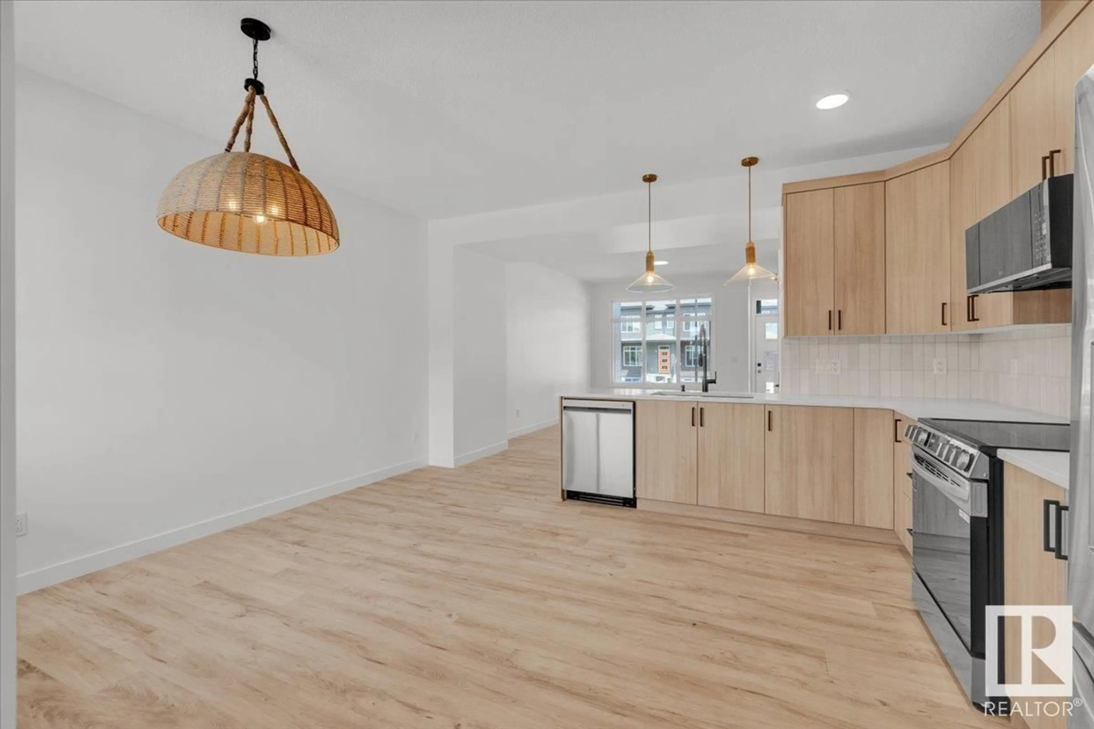 Open concept kitchen, wood/laminate floor for 1341 KESWICK DR, Edmonton Alberta T6W4V8