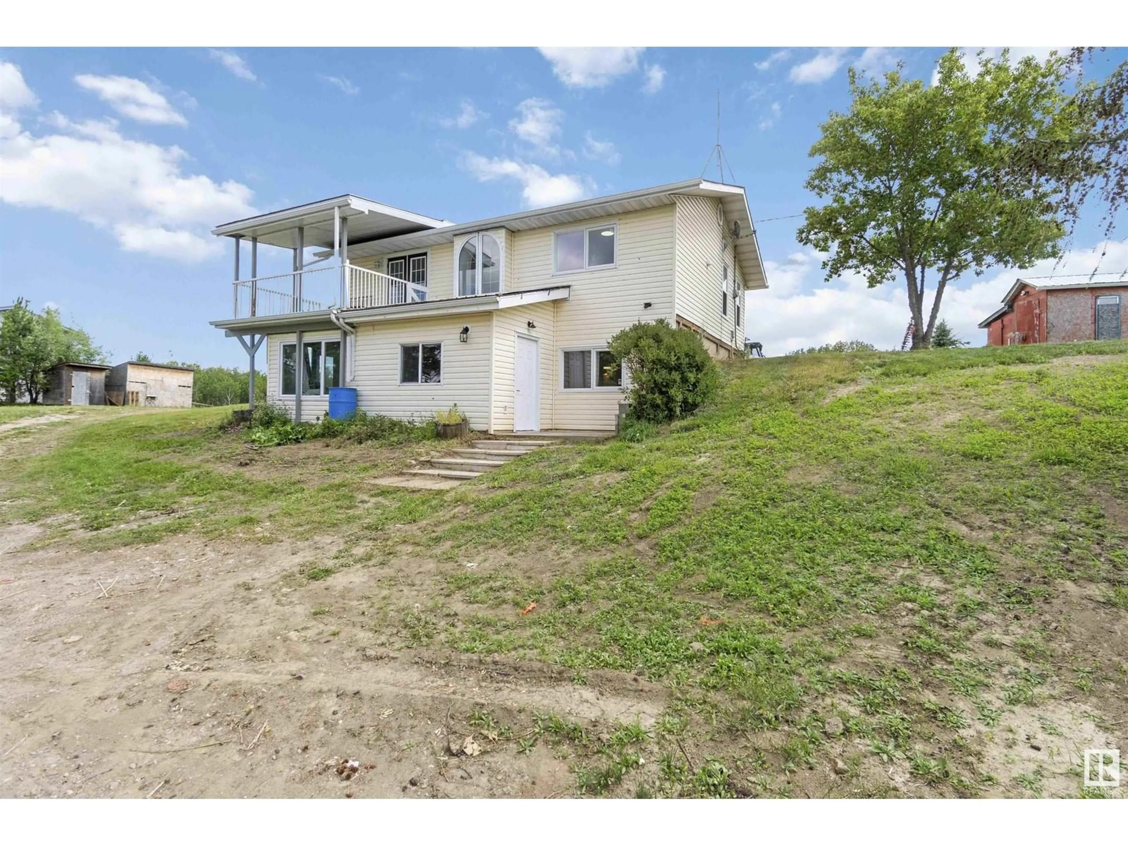 A pic from outside/outdoor area/front of a property/back of a property/a pic from drone, water/lake/river/ocean view for 9 TWP RD 584, Rural Westlock County Alberta T0G1L0