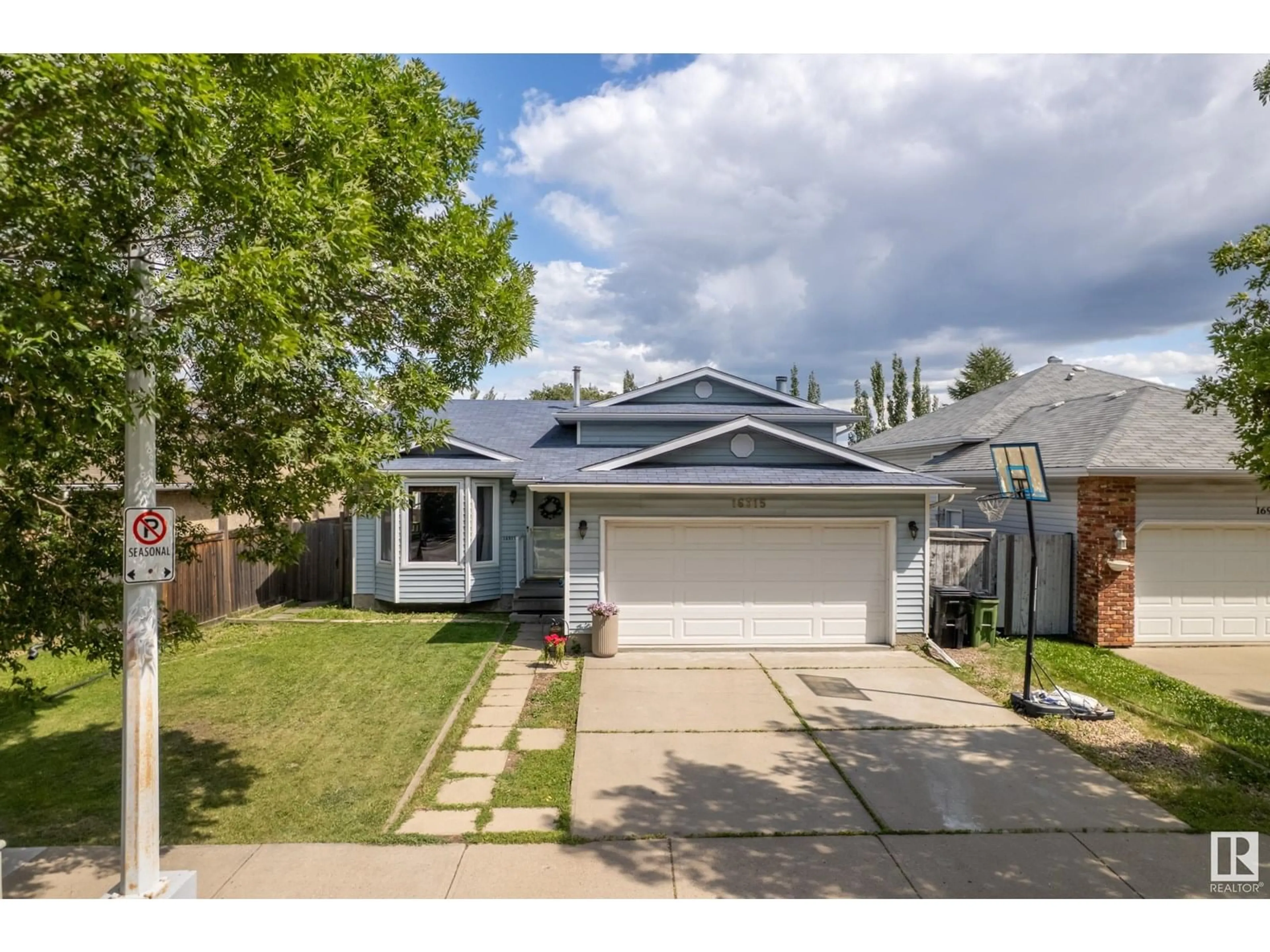 Home with vinyl exterior material, street for NW - 16915 91 ST, Edmonton Alberta T5Z2W7
