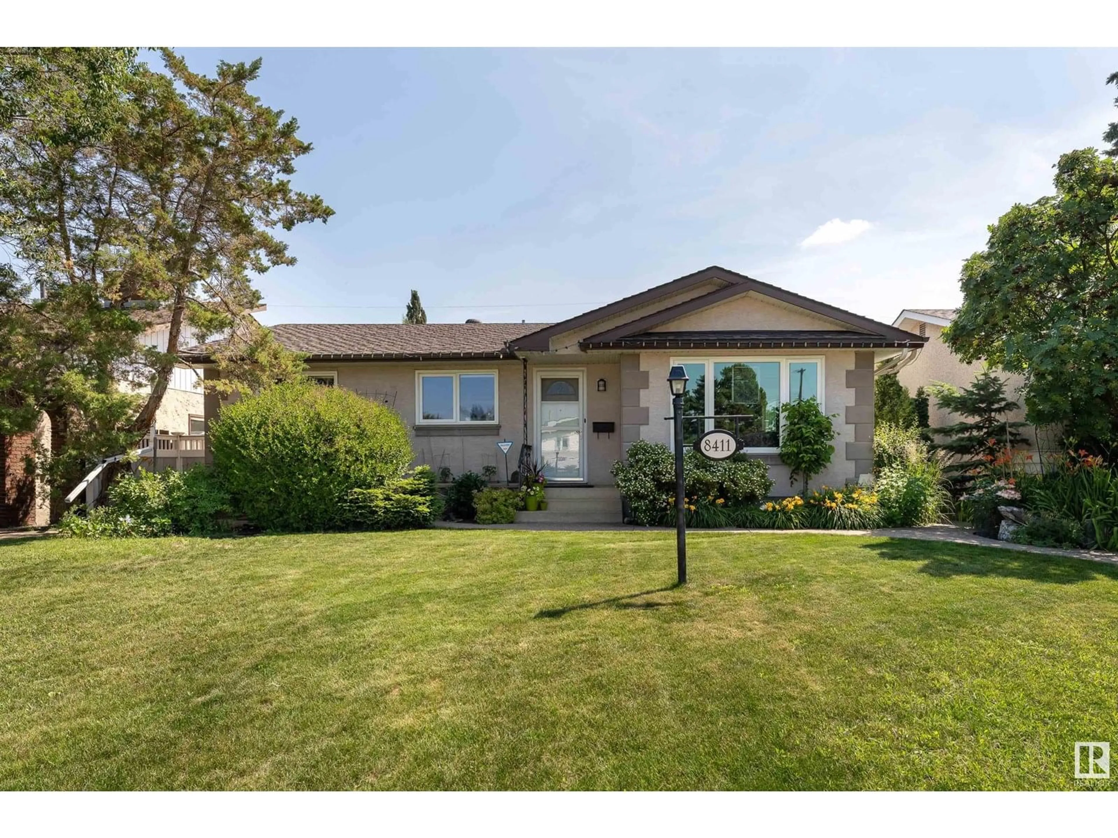 Home with vinyl exterior material, street for 8411 56 ST, Edmonton Alberta T6B1H8