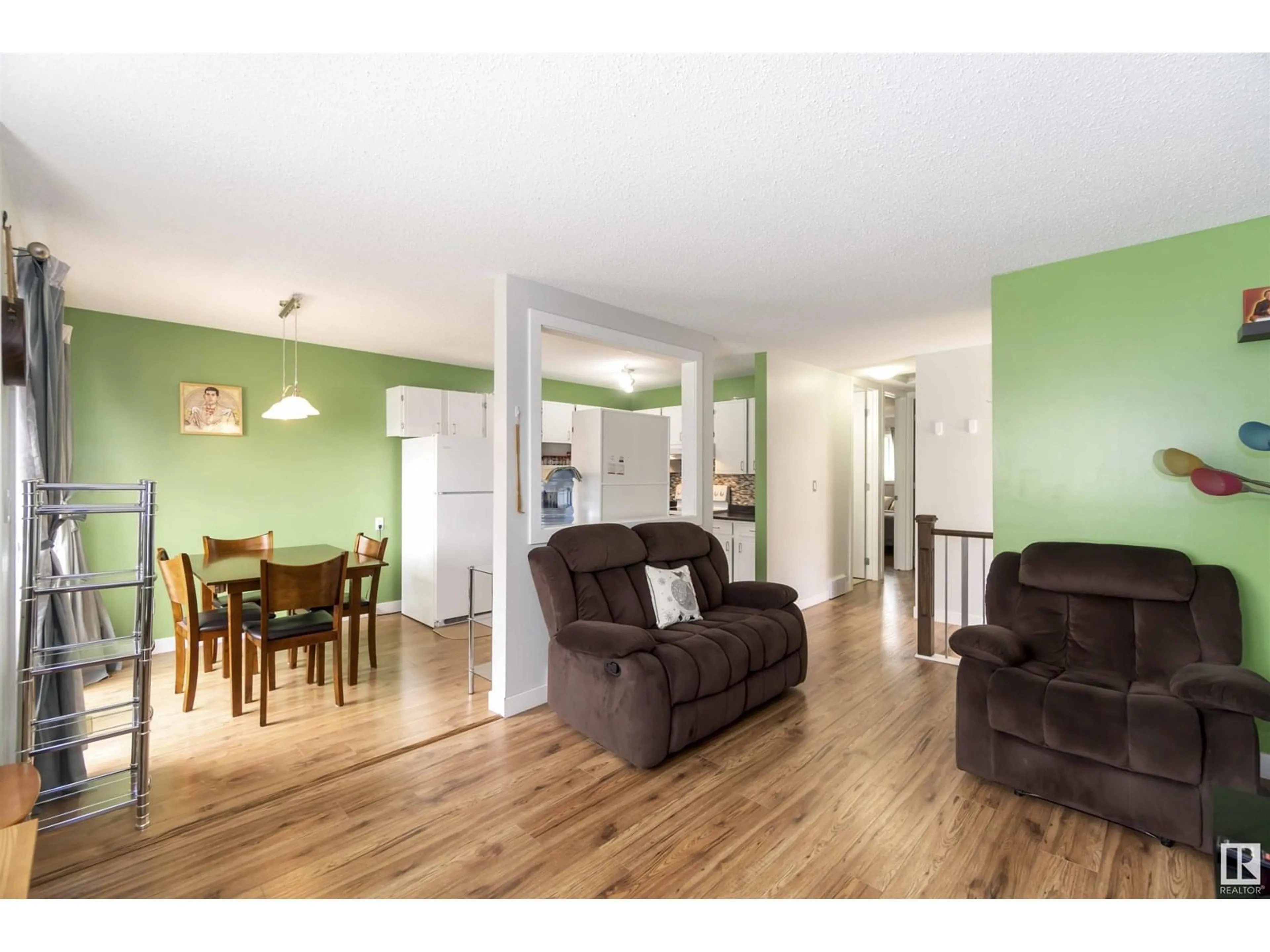 Living room with furniture, wood/laminate floor for 10642 BEAUMARIS RD, Edmonton Alberta T5X3N4