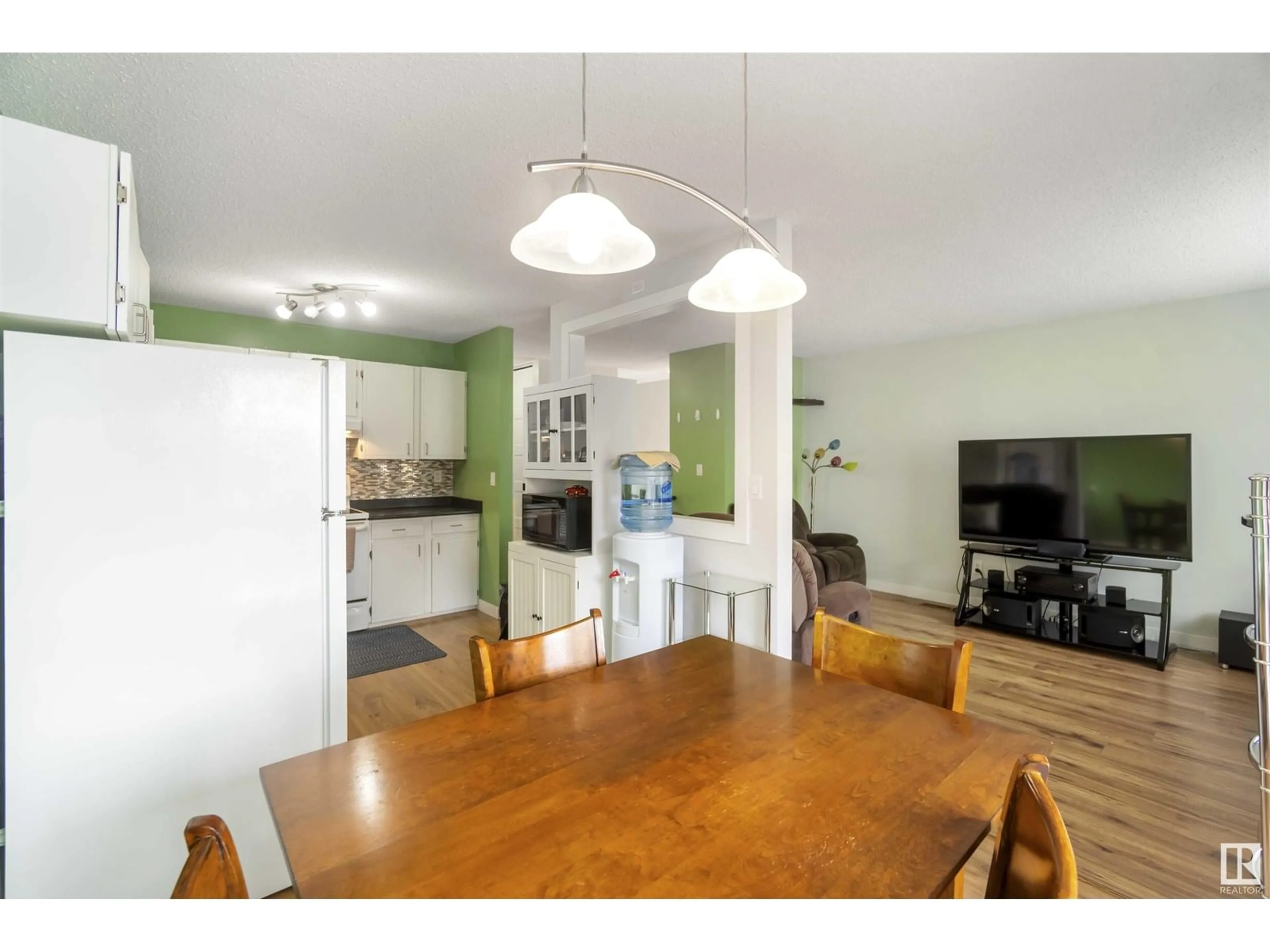 Open concept kitchen, wood/laminate floor for 10642 BEAUMARIS RD, Edmonton Alberta T5X3N4