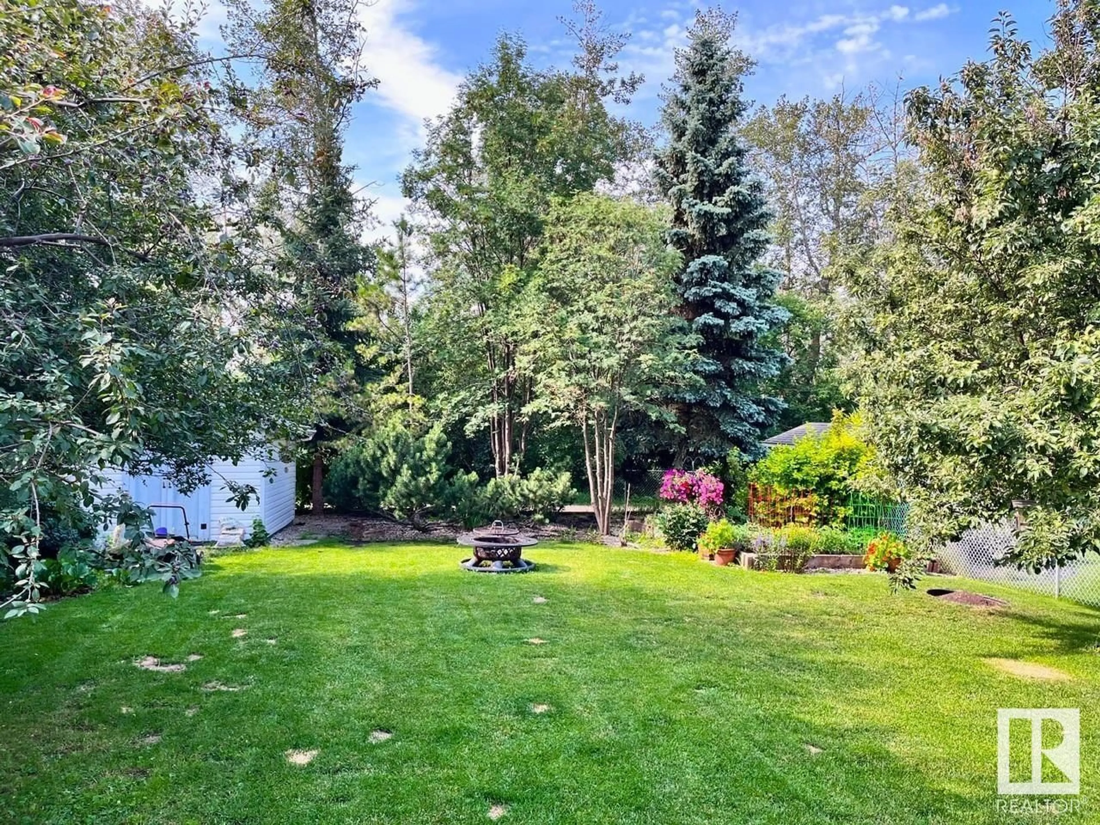A pic from outside/outdoor area/front of a property/back of a property/a pic from drone, forest/trees view for 24 BRIDGEPORT WD, Leduc Alberta T9E8B2