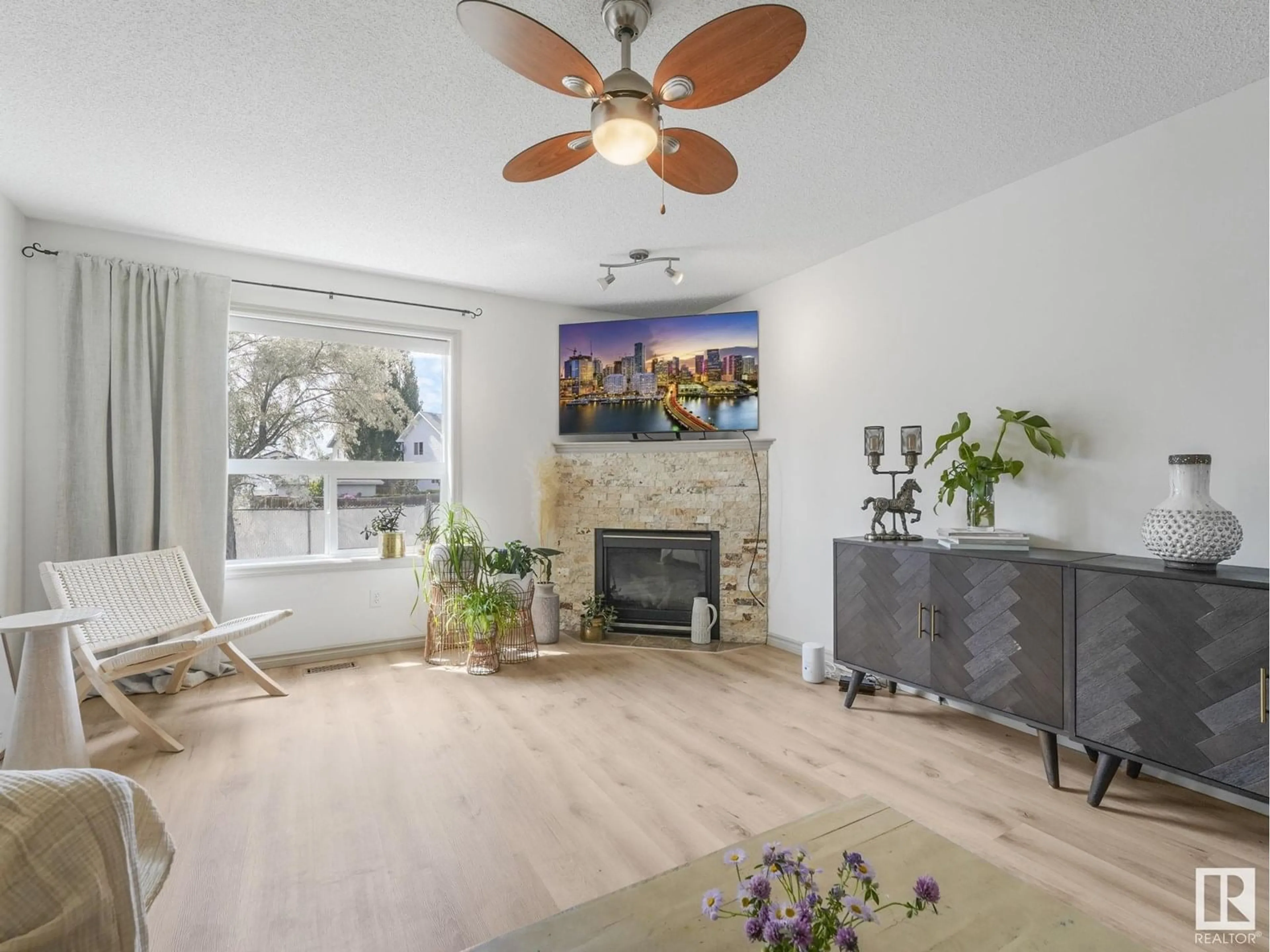 Living room with furniture, wood/laminate floor for 3104 42 ST, Leduc Alberta T9E8L2