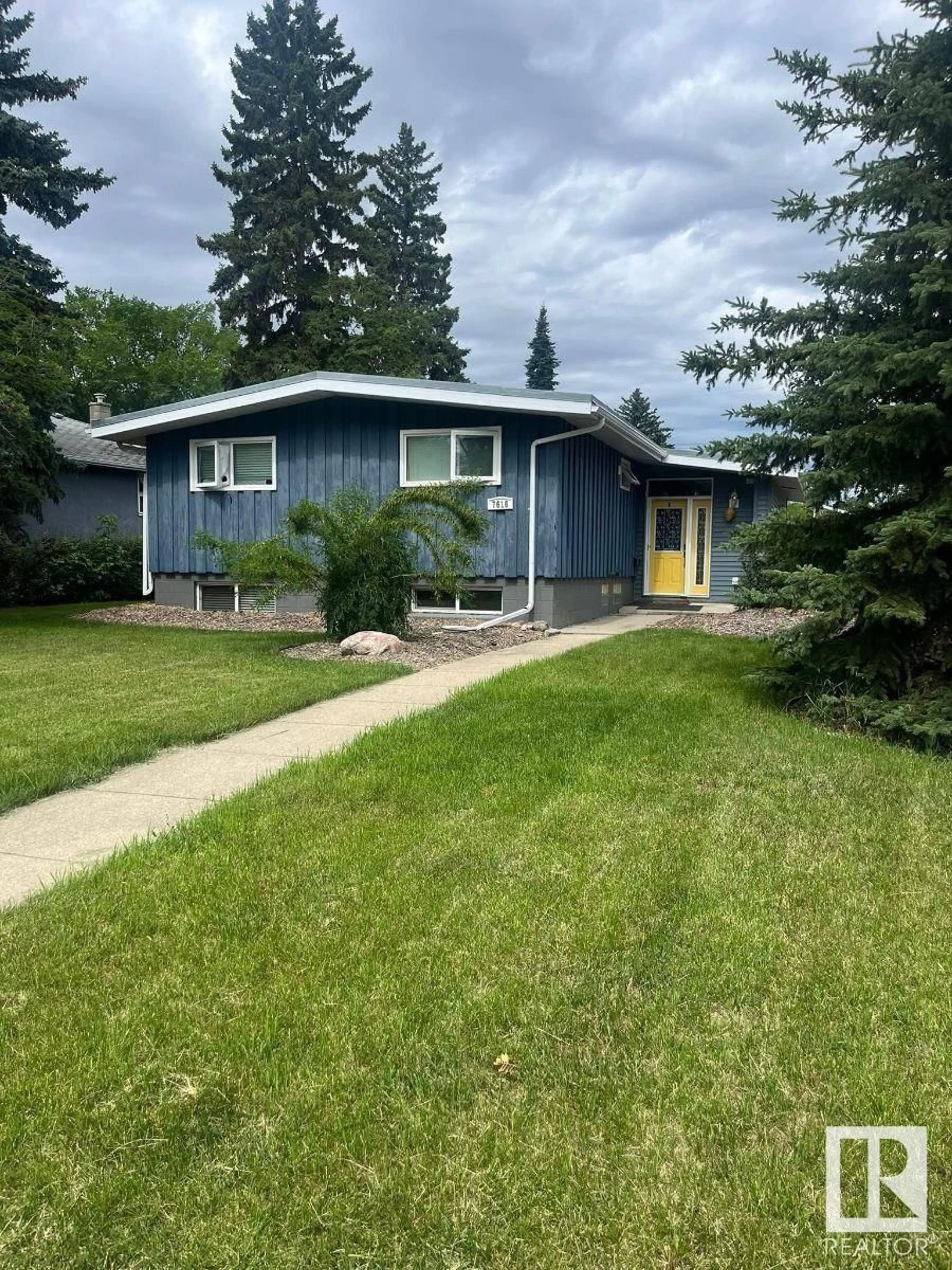 Home with vinyl exterior material, street for 7616 95 AV, Edmonton Alberta T6C1X7