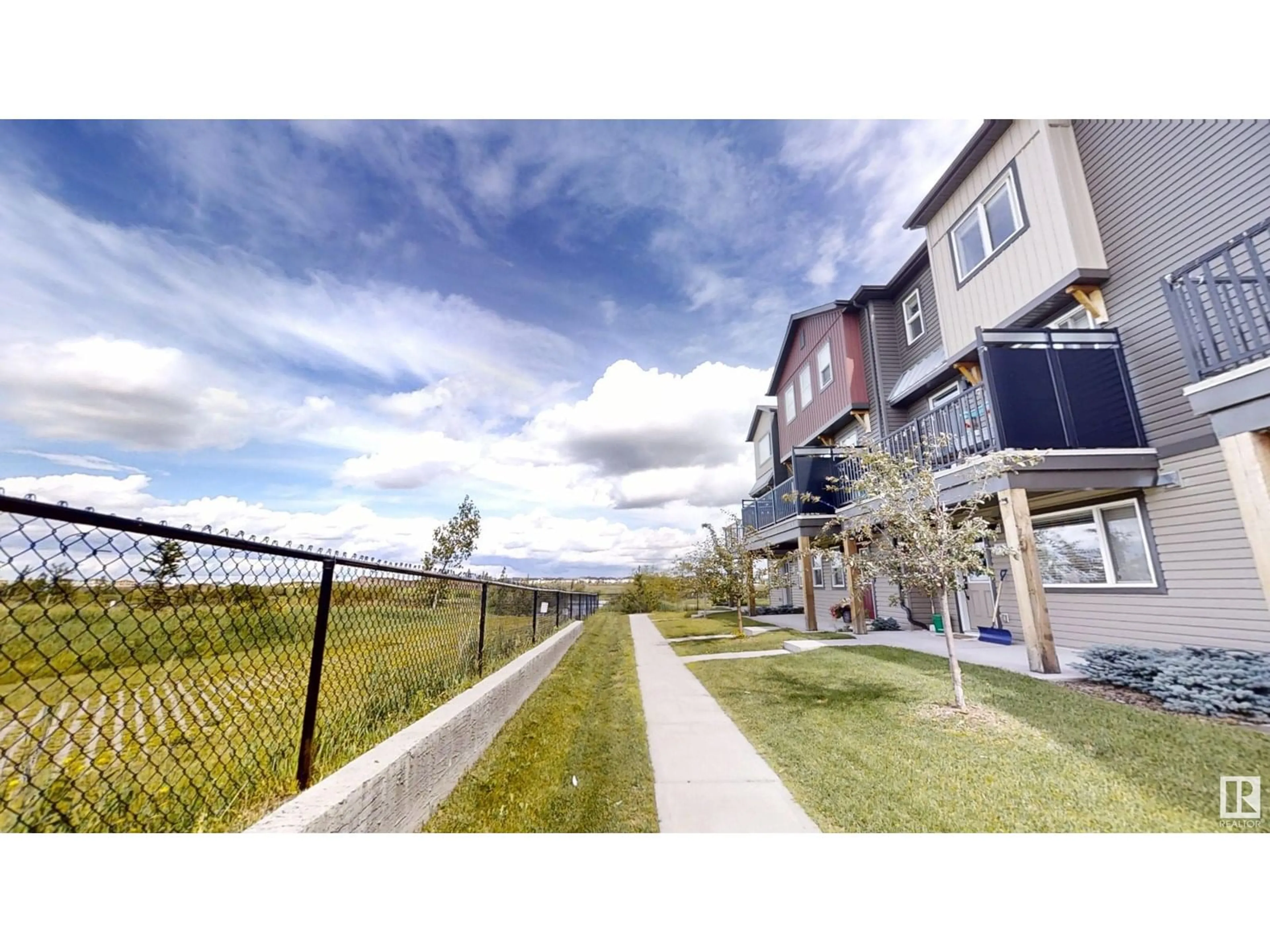A pic from outside/outdoor area/front of a property/back of a property/a pic from drone, mountain view for #140 - 16903 68 ST, Edmonton Alberta T5Z0R1