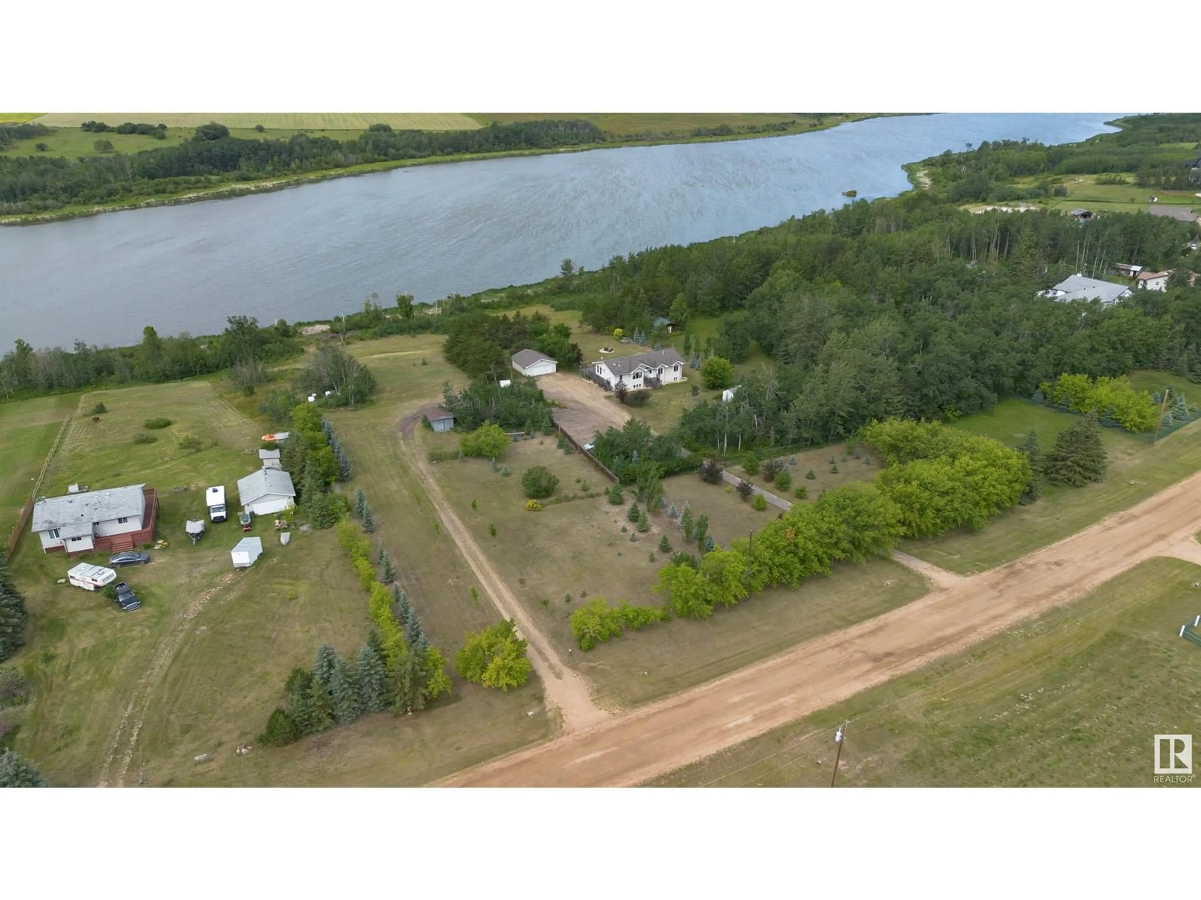 A pic from outside/outdoor area/front of a property/back of a property/a pic from drone, water/lake/river/ocean view for 32 23329 SH 651, Rural Sturgeon County Alberta T0A1N6