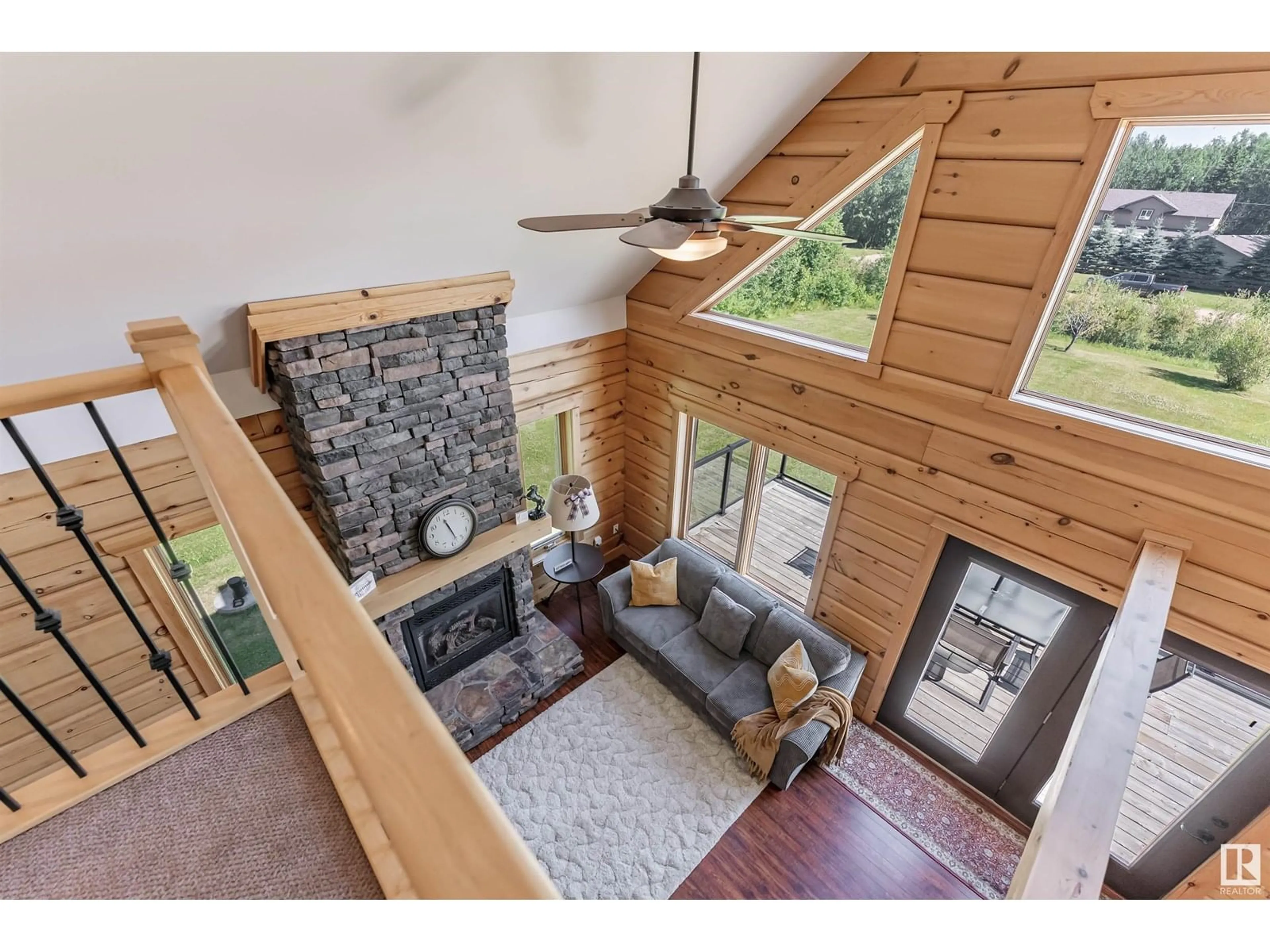Living room with furniture, wood/laminate floor for 139 462054 RGE ROAD 11, Rural Wetaskiwin County Alberta T0C2V0