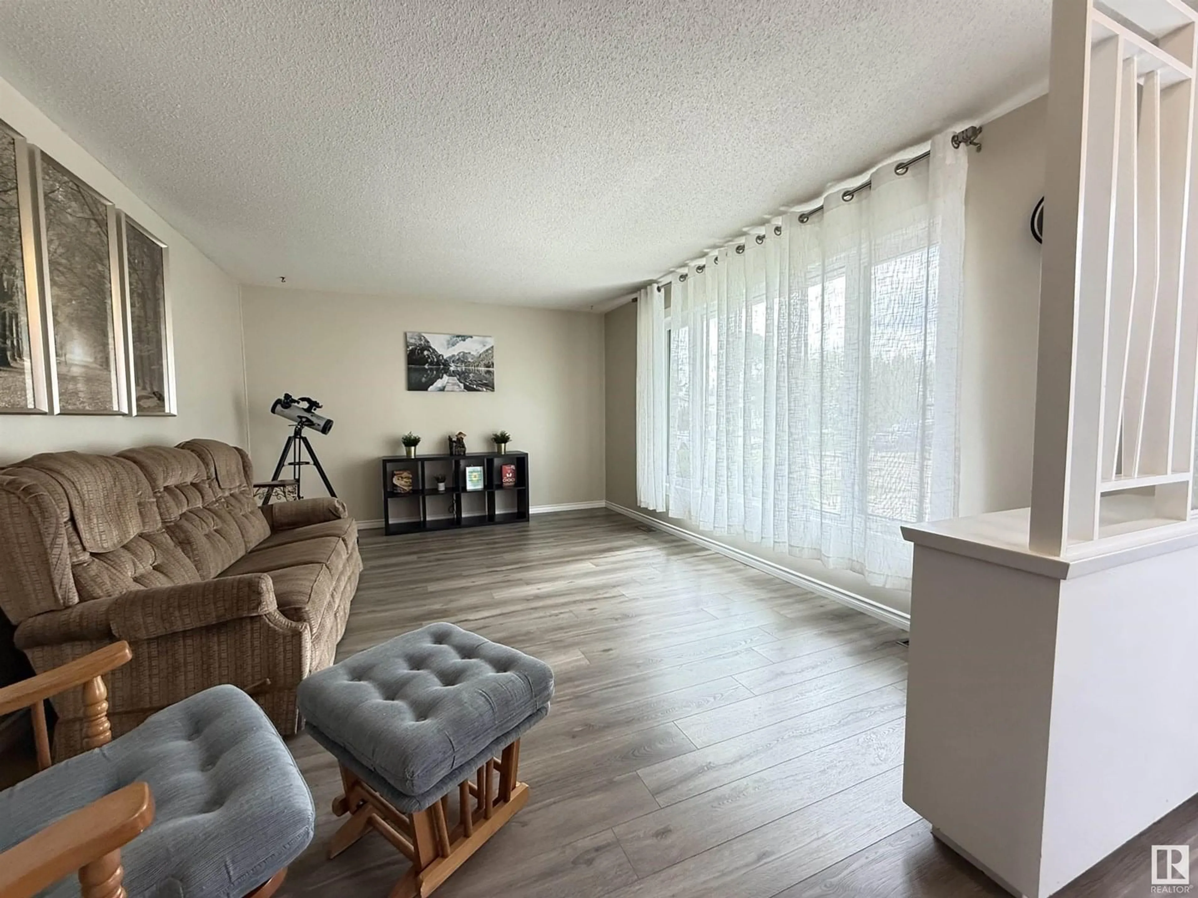 Living room with furniture, wood/laminate floor for 24 STARLING DR, Sherwood Park Alberta T8A0A7