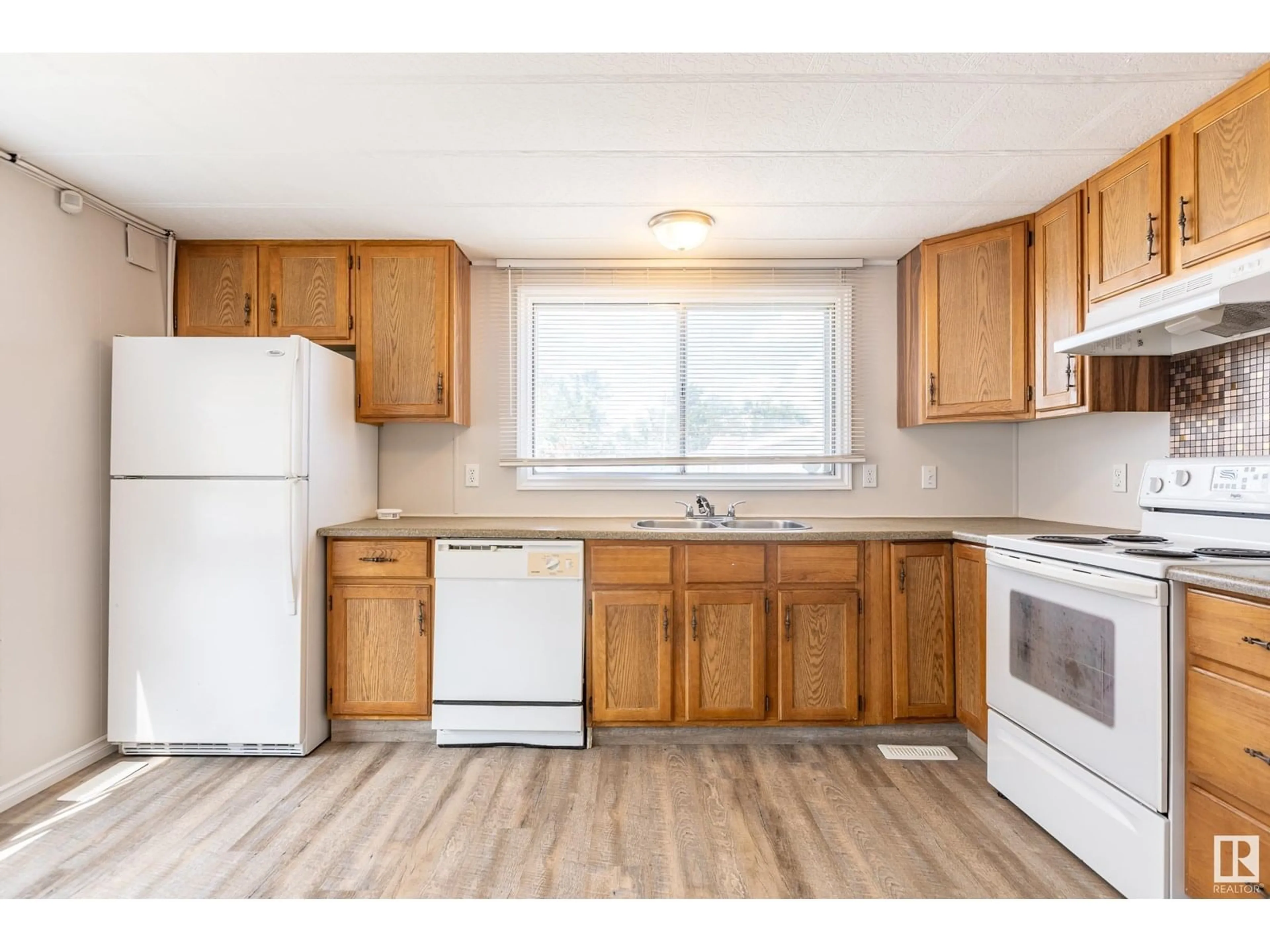 Standard kitchen, wood/laminate floor for 55 - 10410 101A ST, Morinville Alberta T8R1B1