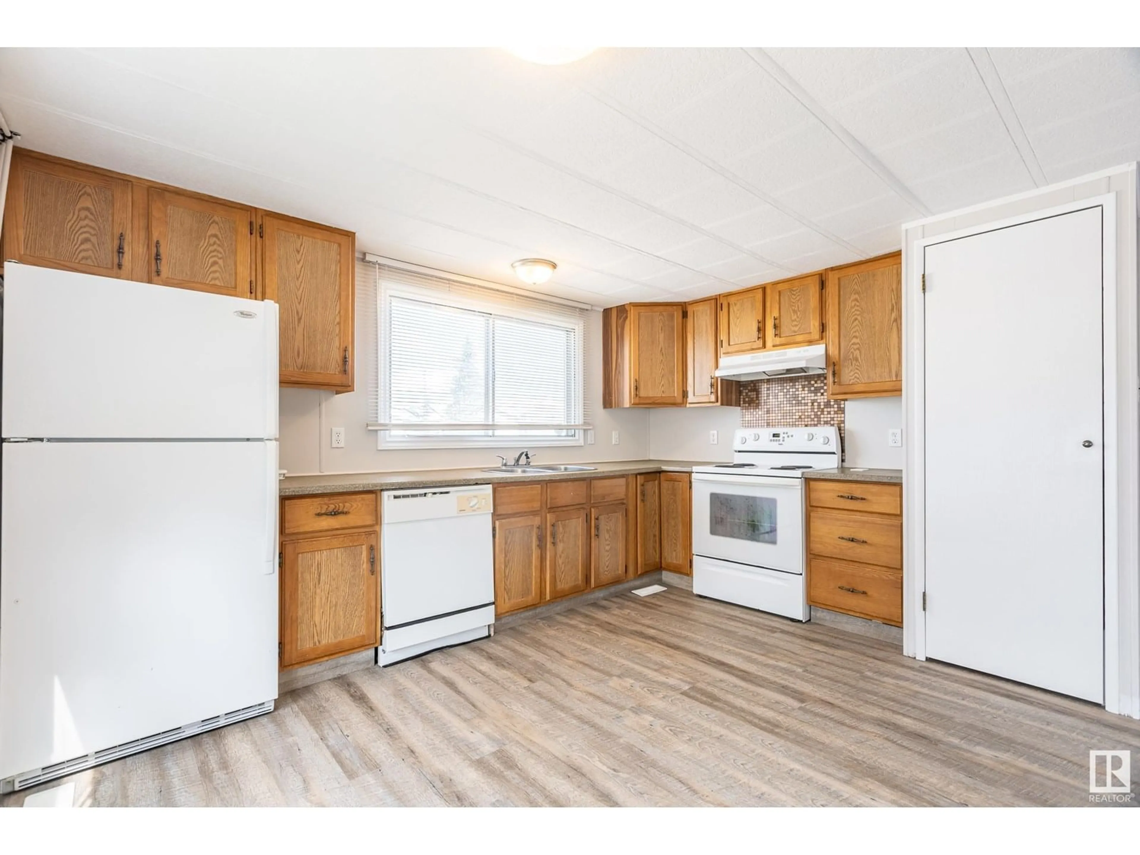Standard kitchen, wood/laminate floor for 55 - 10410 101A ST, Morinville Alberta T8R1B1