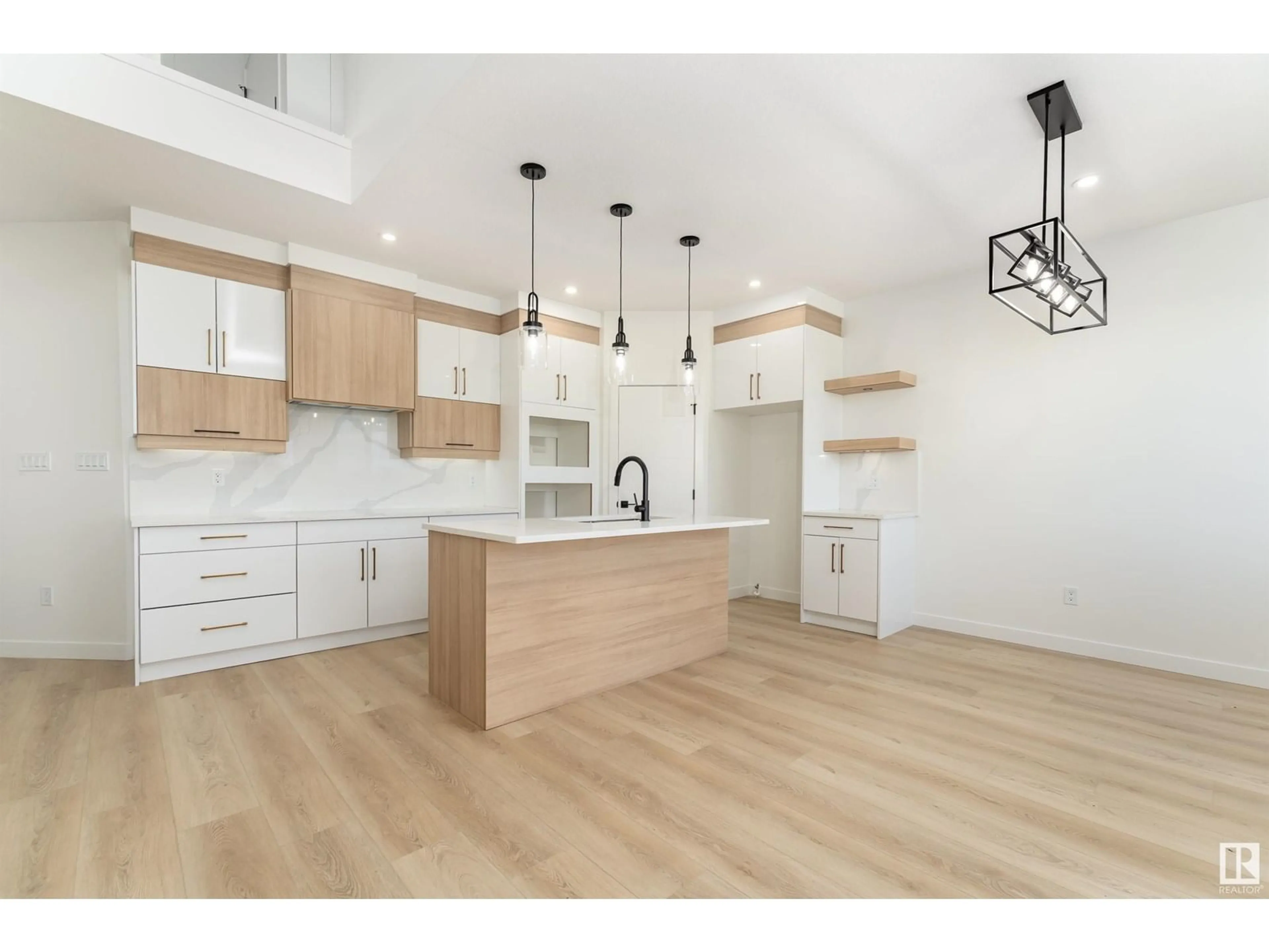 Open concept kitchen, wood/laminate floor for 76 HAZELWOOD LN, Spruce Grove Alberta T7X0R7