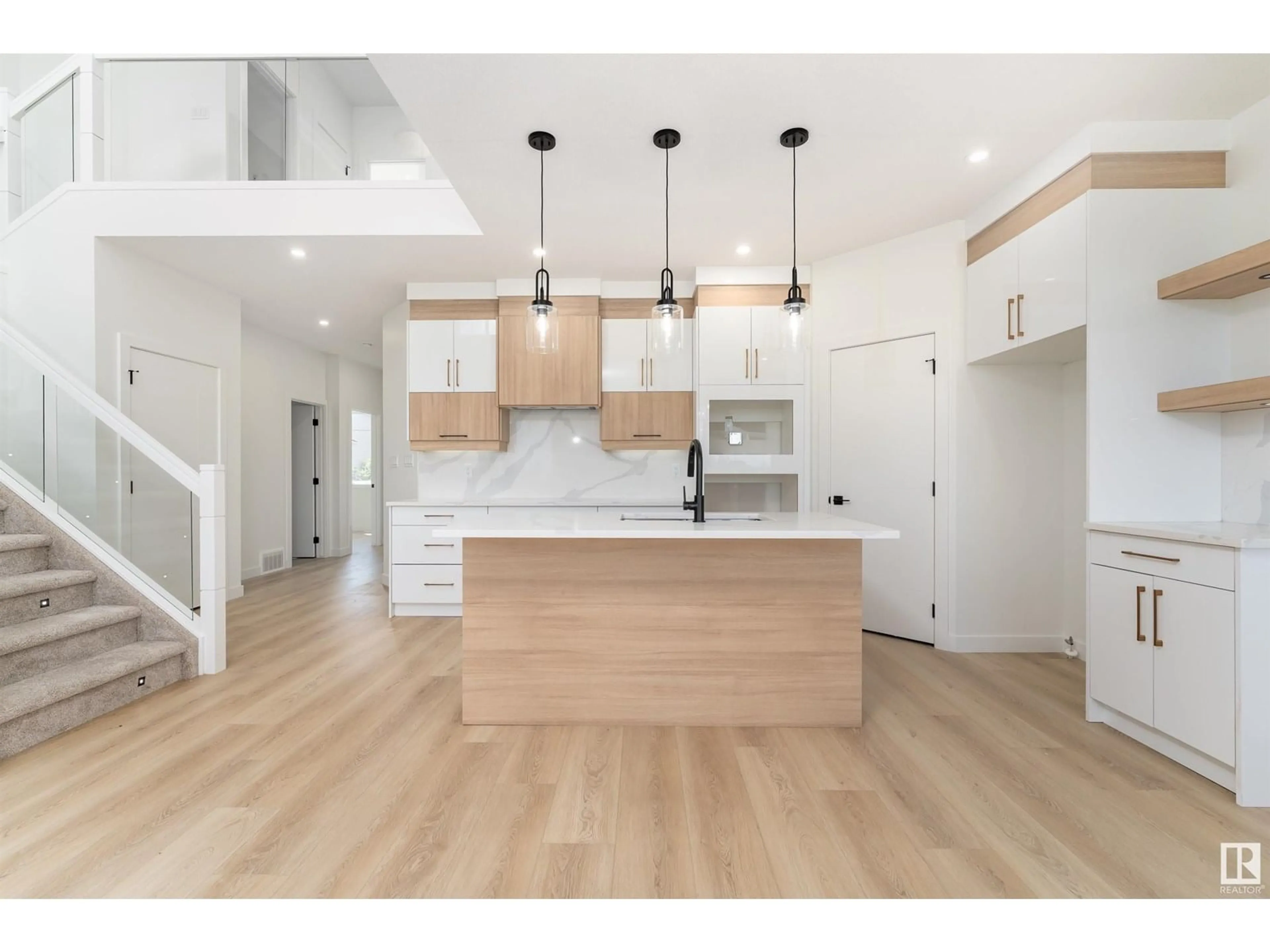 Open concept kitchen, wood/laminate floor for 76 HAZELWOOD LN, Spruce Grove Alberta T7X0R7