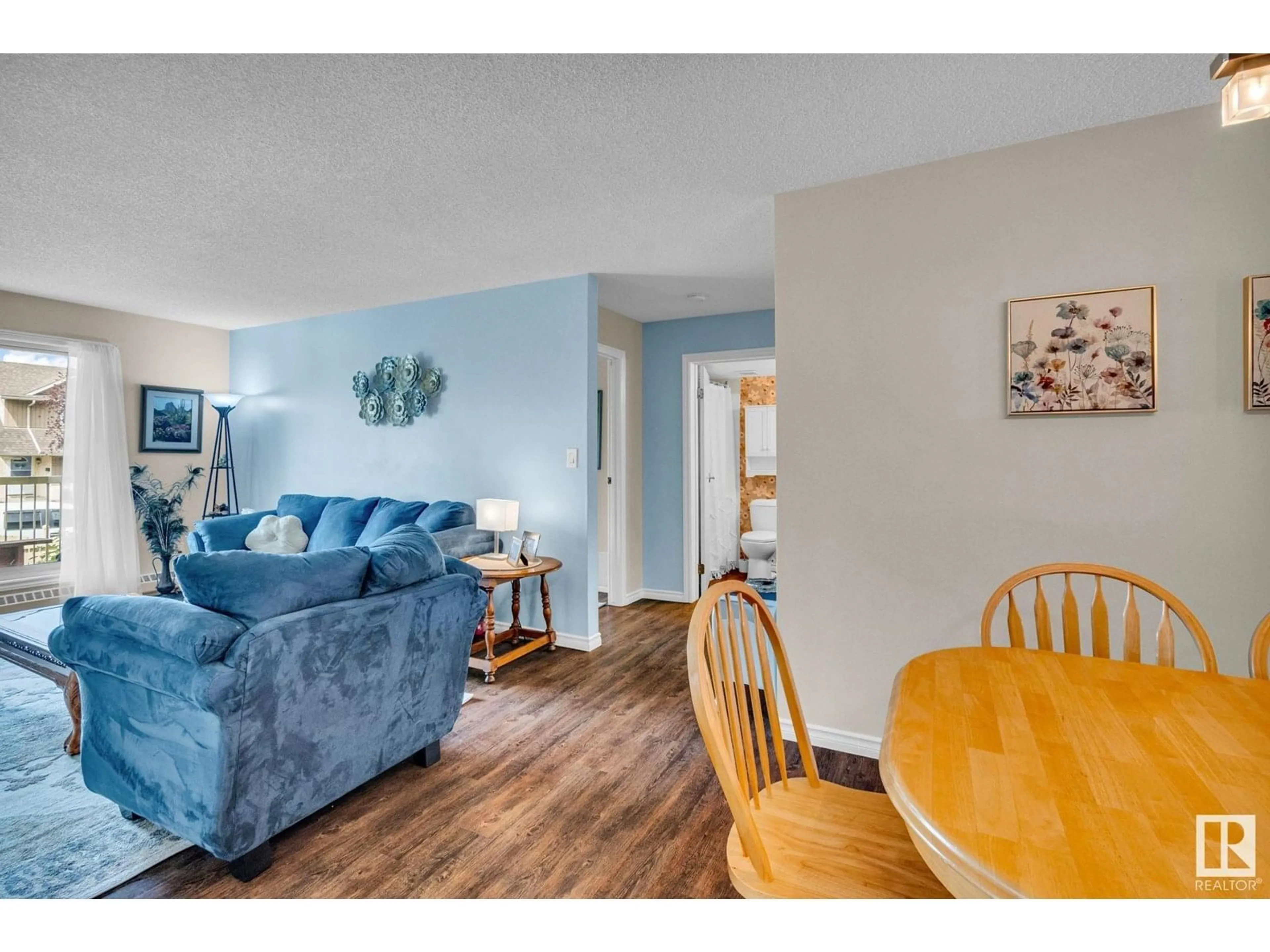 Living room with furniture, wood/laminate floor for 217 - 18012 95 AV, Edmonton Alberta T5T5Z2