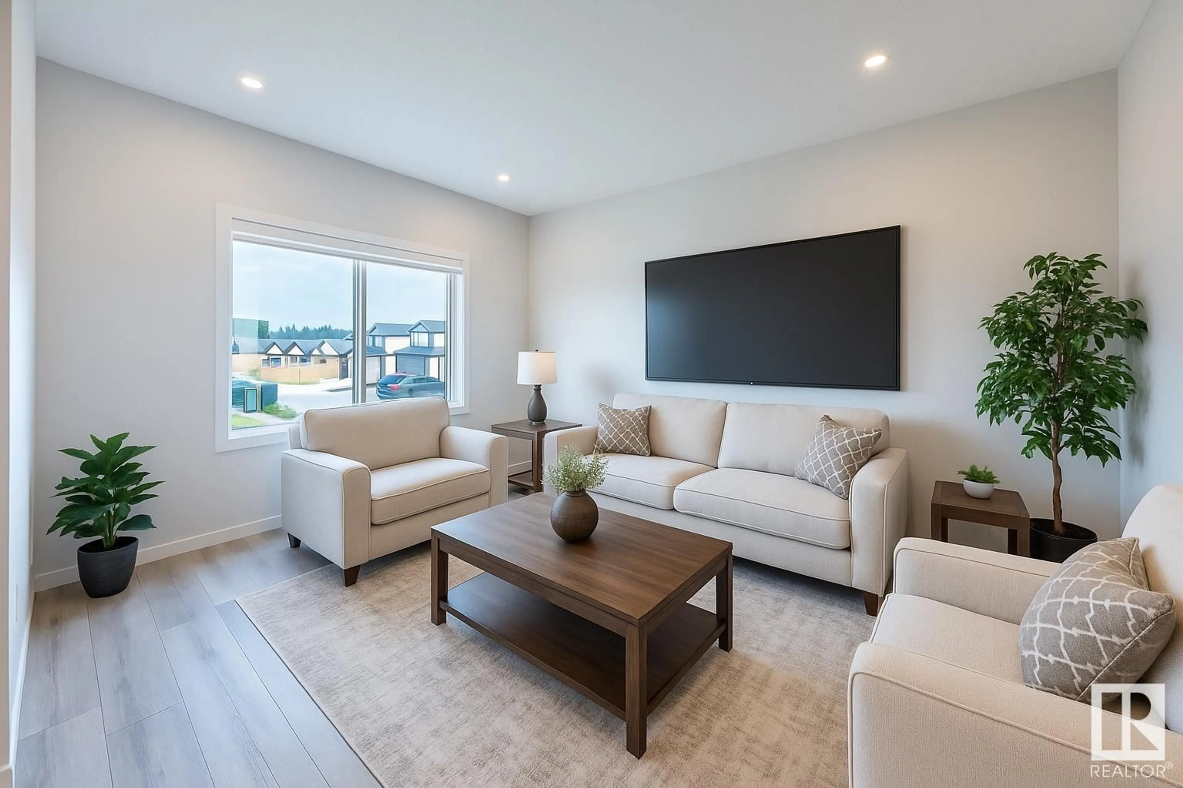 Living room with furniture, wood/laminate floor for 308 36 AV, Edmonton Alberta T6T2P9