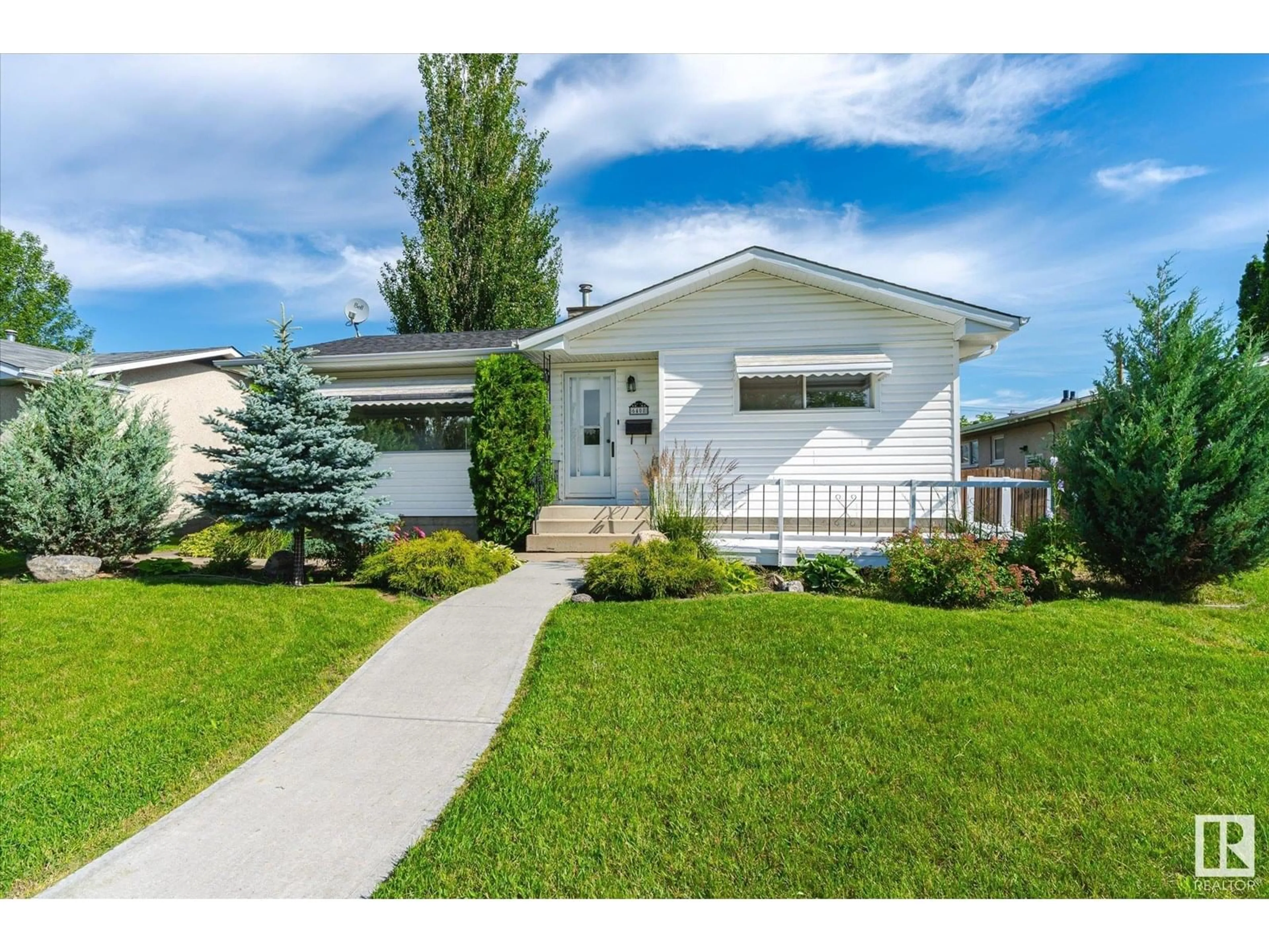 Home with vinyl exterior material, street for 6408 133A AV, Edmonton Alberta T5A0K5