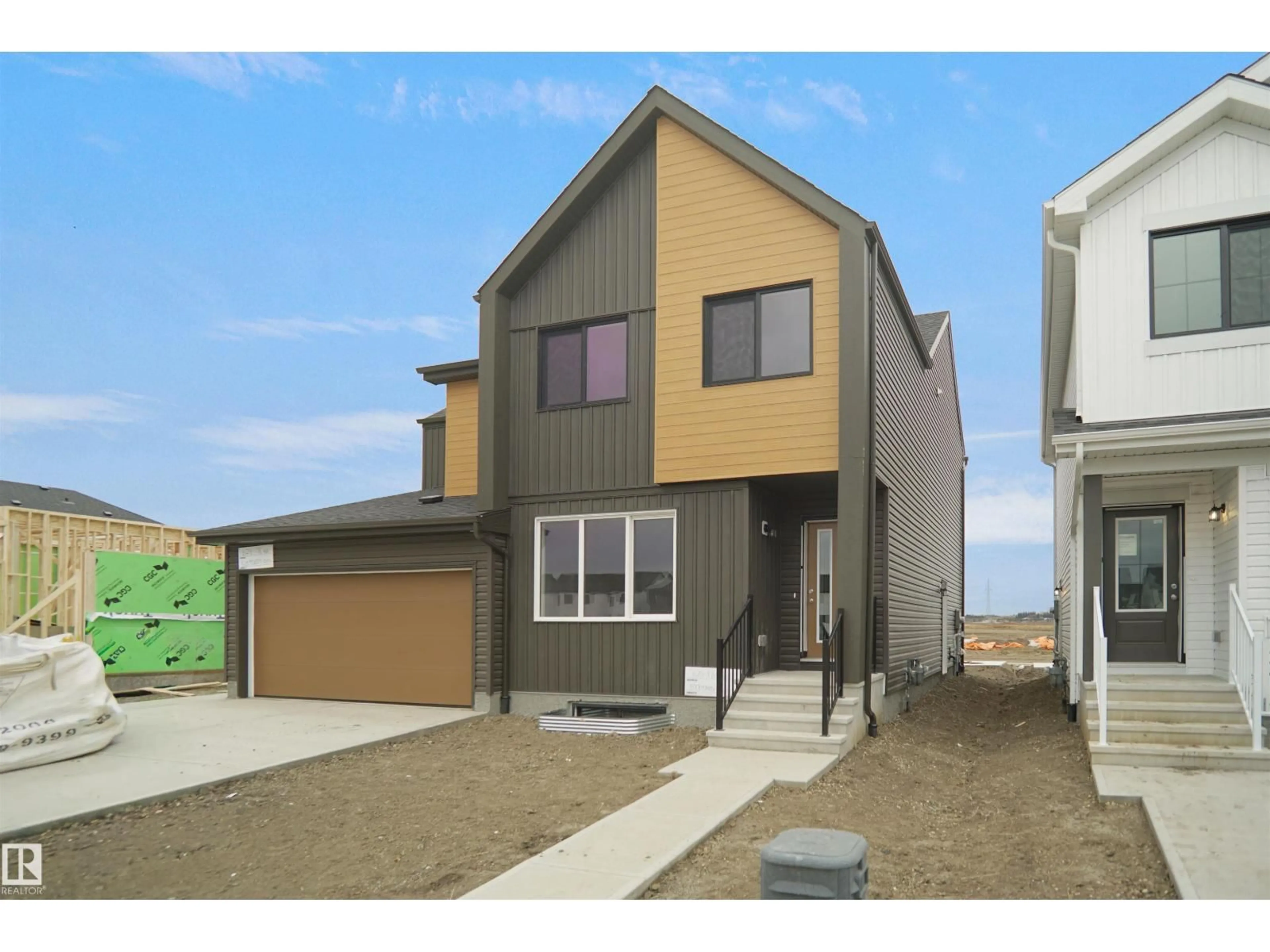 Home with vinyl exterior material, street for 626 176 AV, Edmonton Alberta T5Y4G1