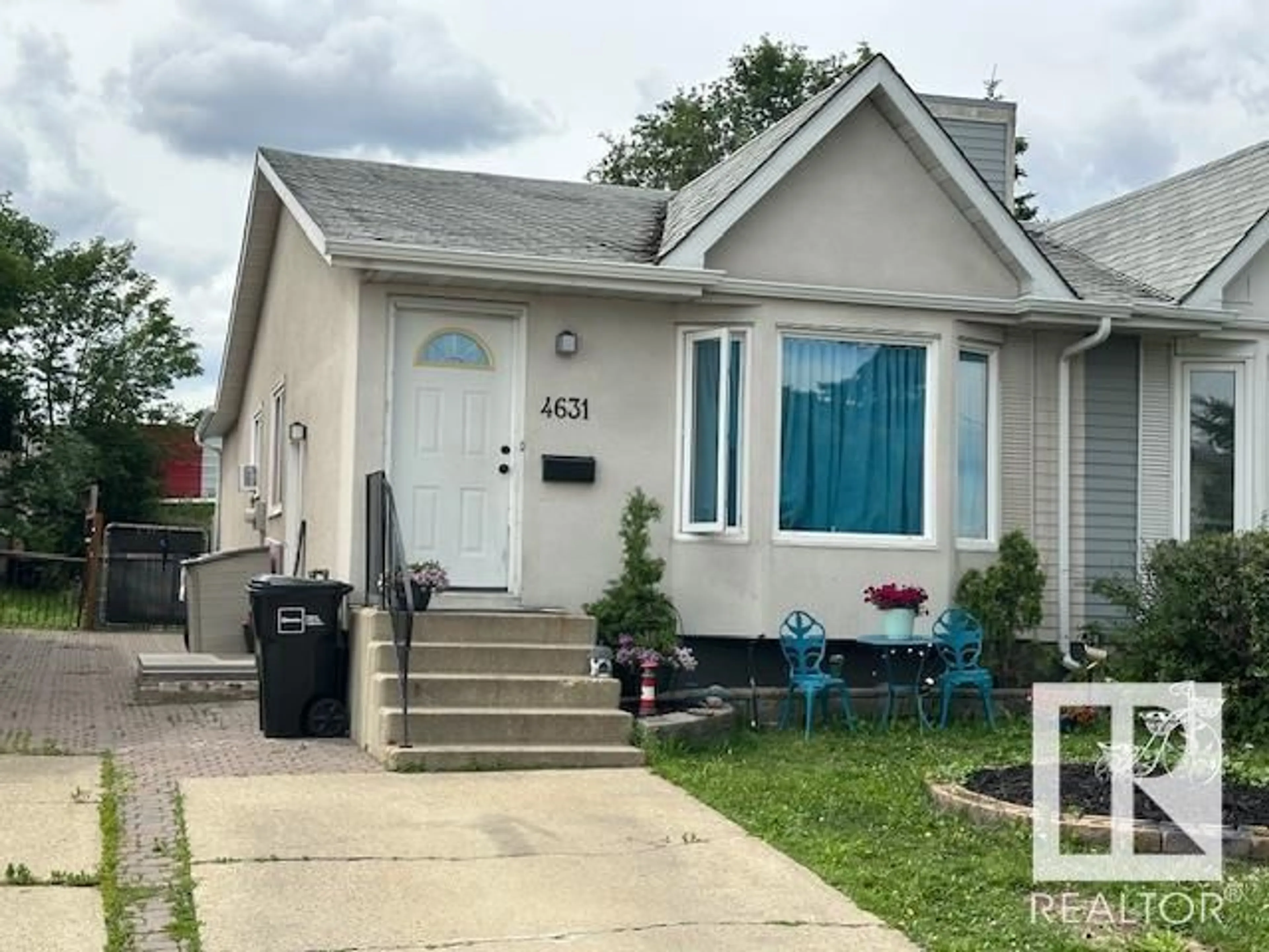 Home with vinyl exterior material, street for 4631 126 AV, Edmonton Alberta T5A4L1