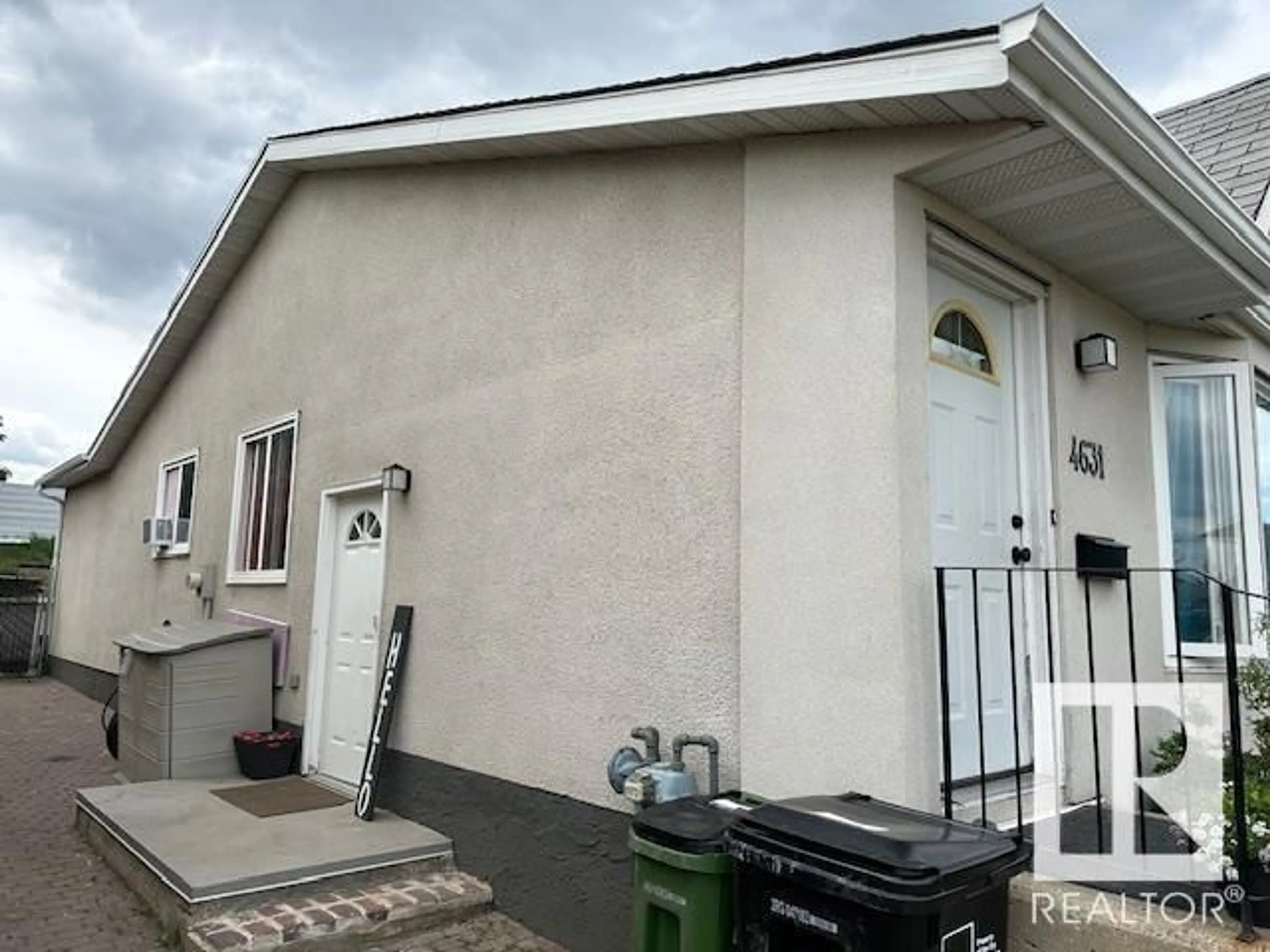 Home with vinyl exterior material, street for 4631 126 AV, Edmonton Alberta T5A4L1