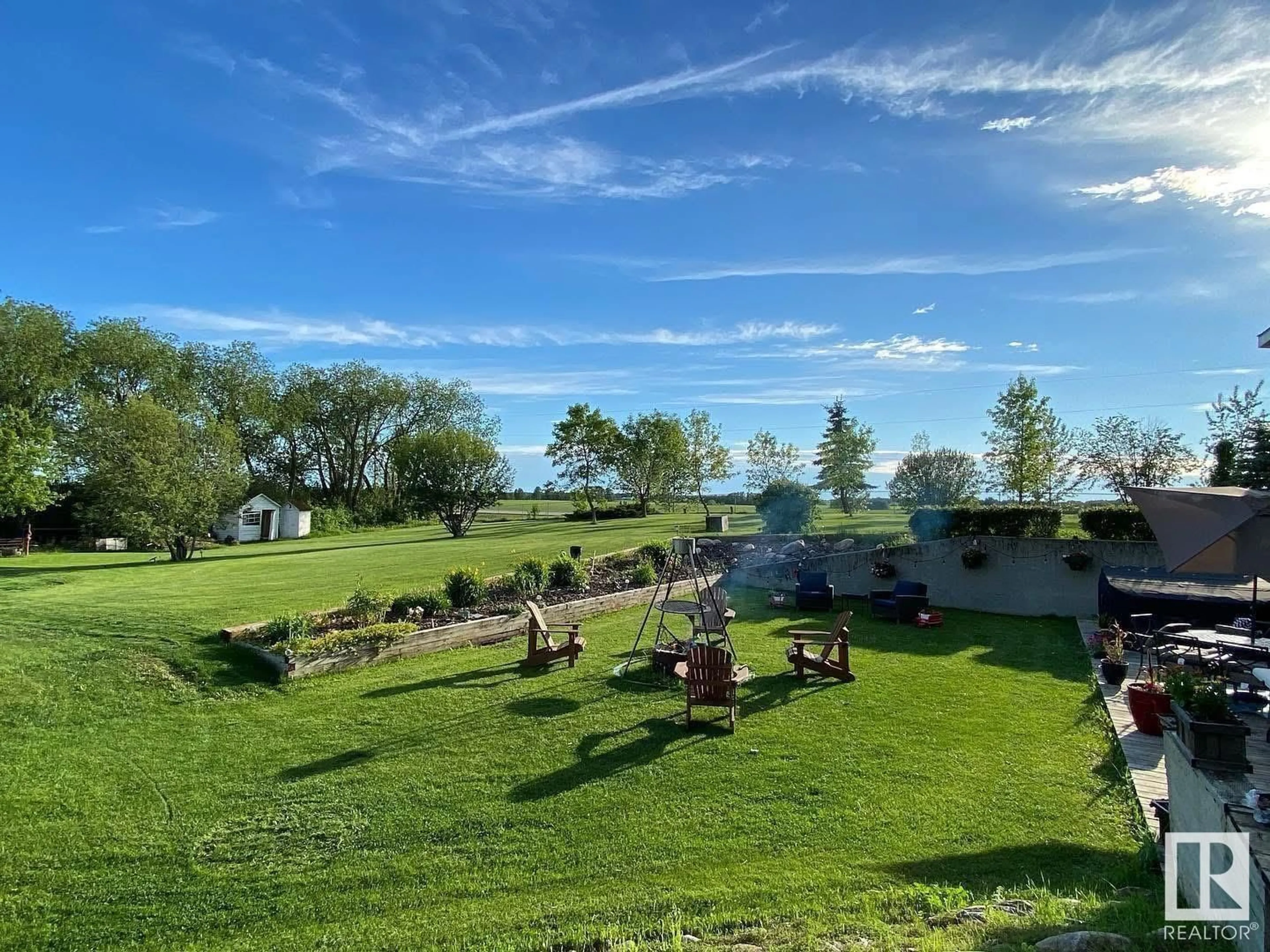 A pic from outside/outdoor area/front of a property/back of a property/a pic from drone, water/lake/river/ocean view for 49231 HWY 814 NW, Rural Leduc County Alberta T4X2R1