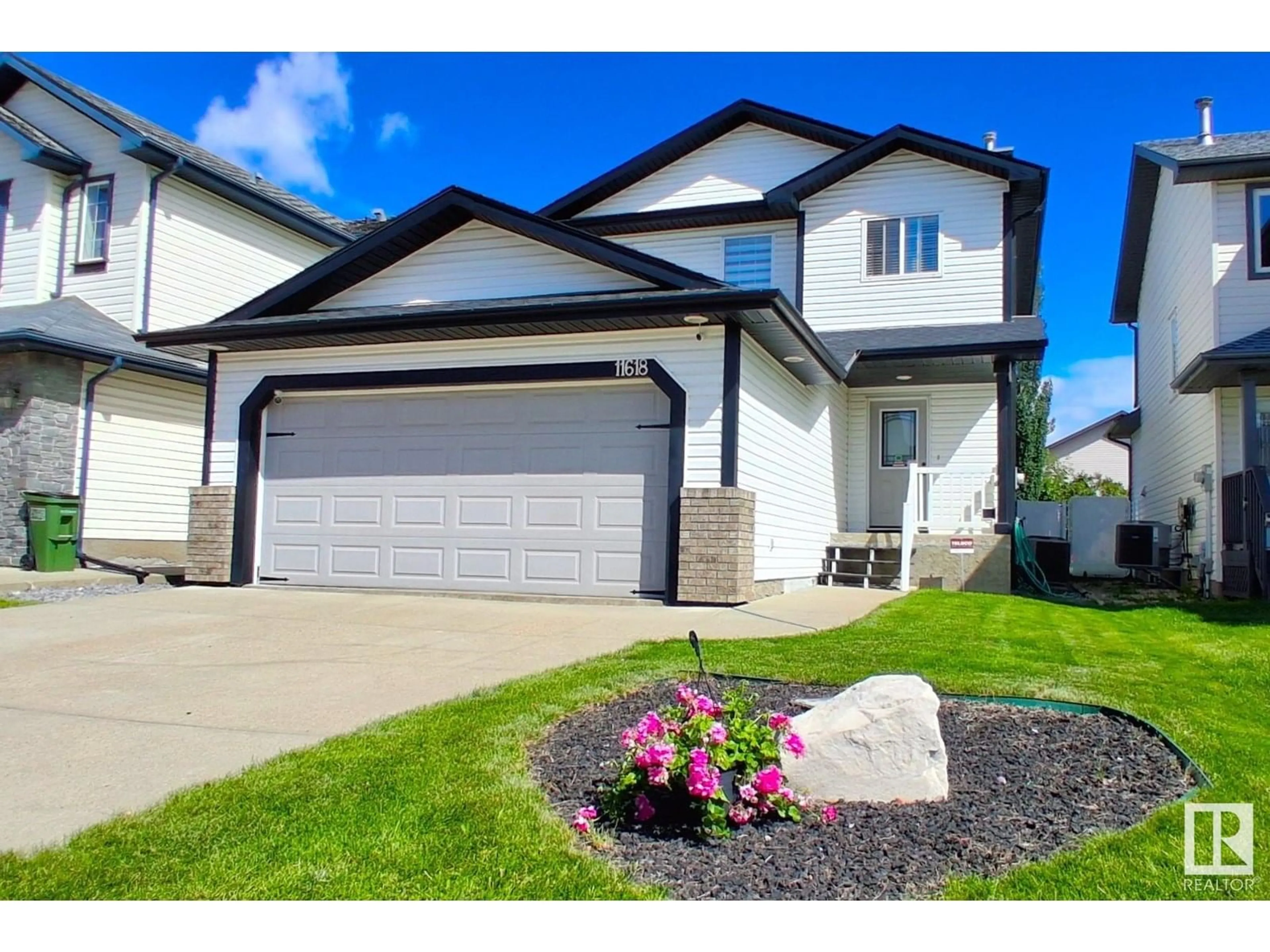 Home with vinyl exterior material, street for NW - 11618 173A AV, Edmonton Alberta T5X6C5