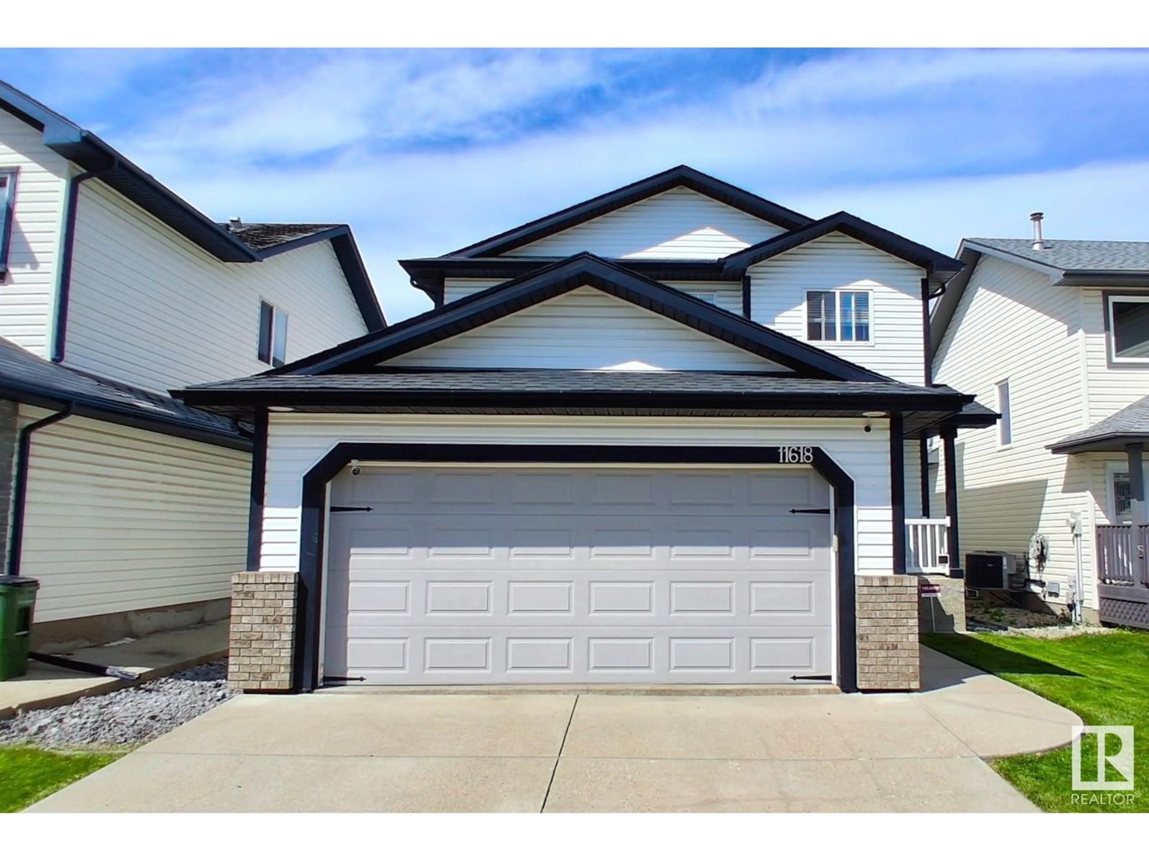 Home with vinyl exterior material, street for NW - 11618 173A AV, Edmonton Alberta T5X6C5