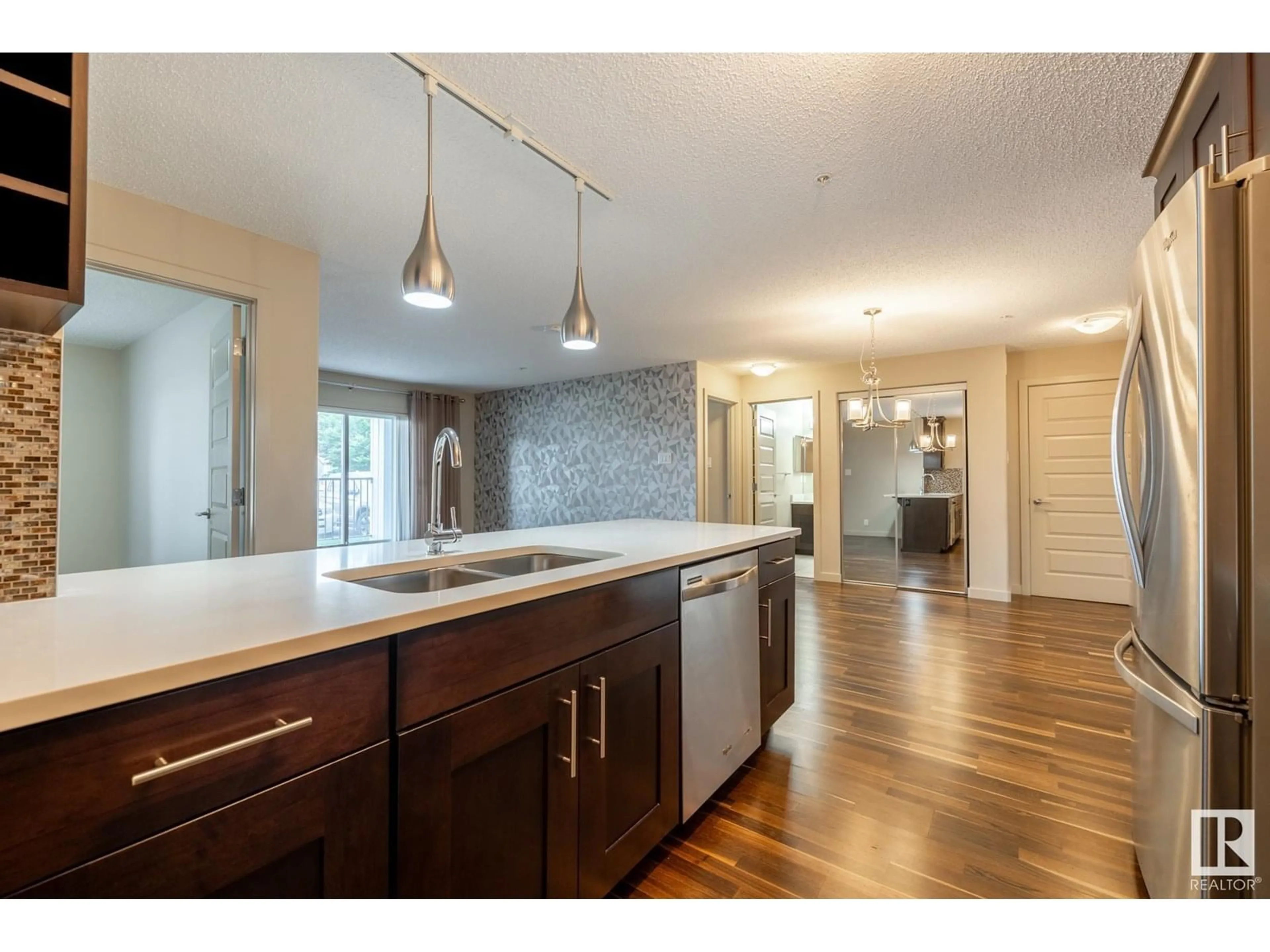 Open concept kitchen, unknown for #116 - 4008 SAVARYN DR, Edmonton Alberta T6X2E5