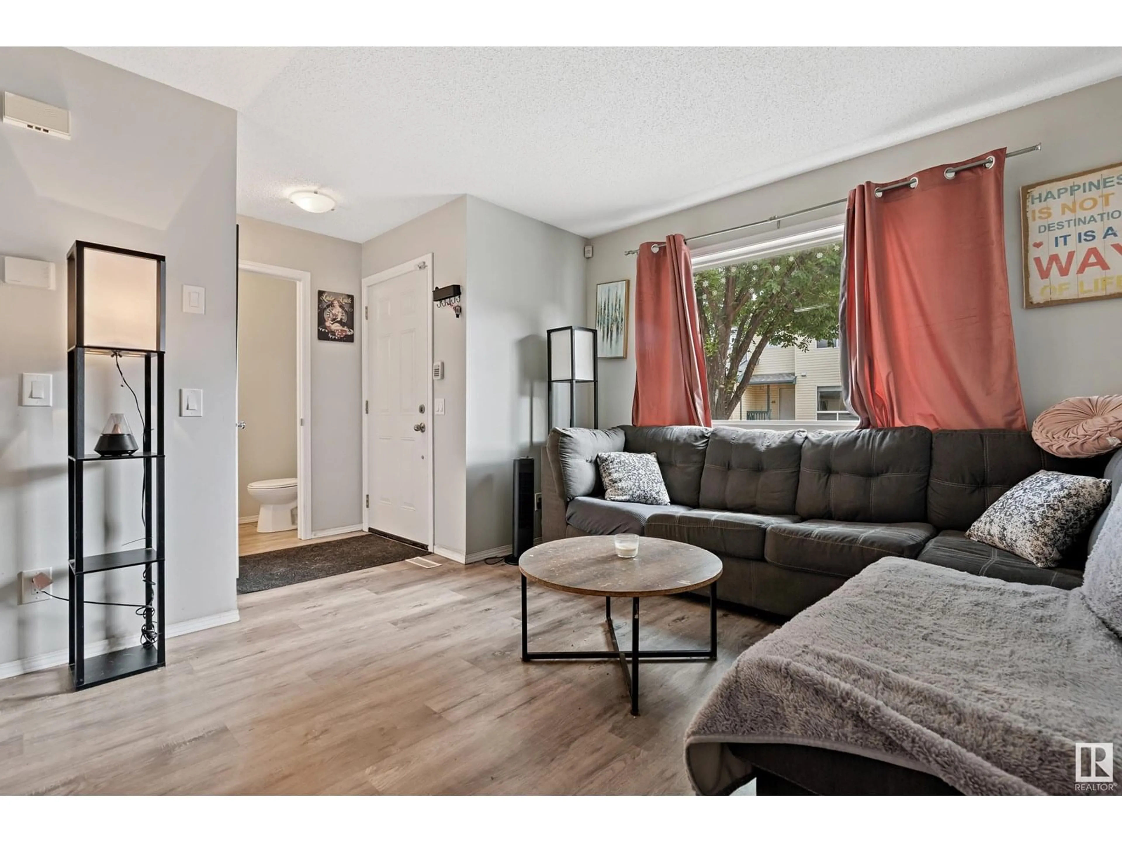 Living room with furniture, wood/laminate floor for 42 - 10909 106 ST NW, Edmonton Alberta T5H4M7