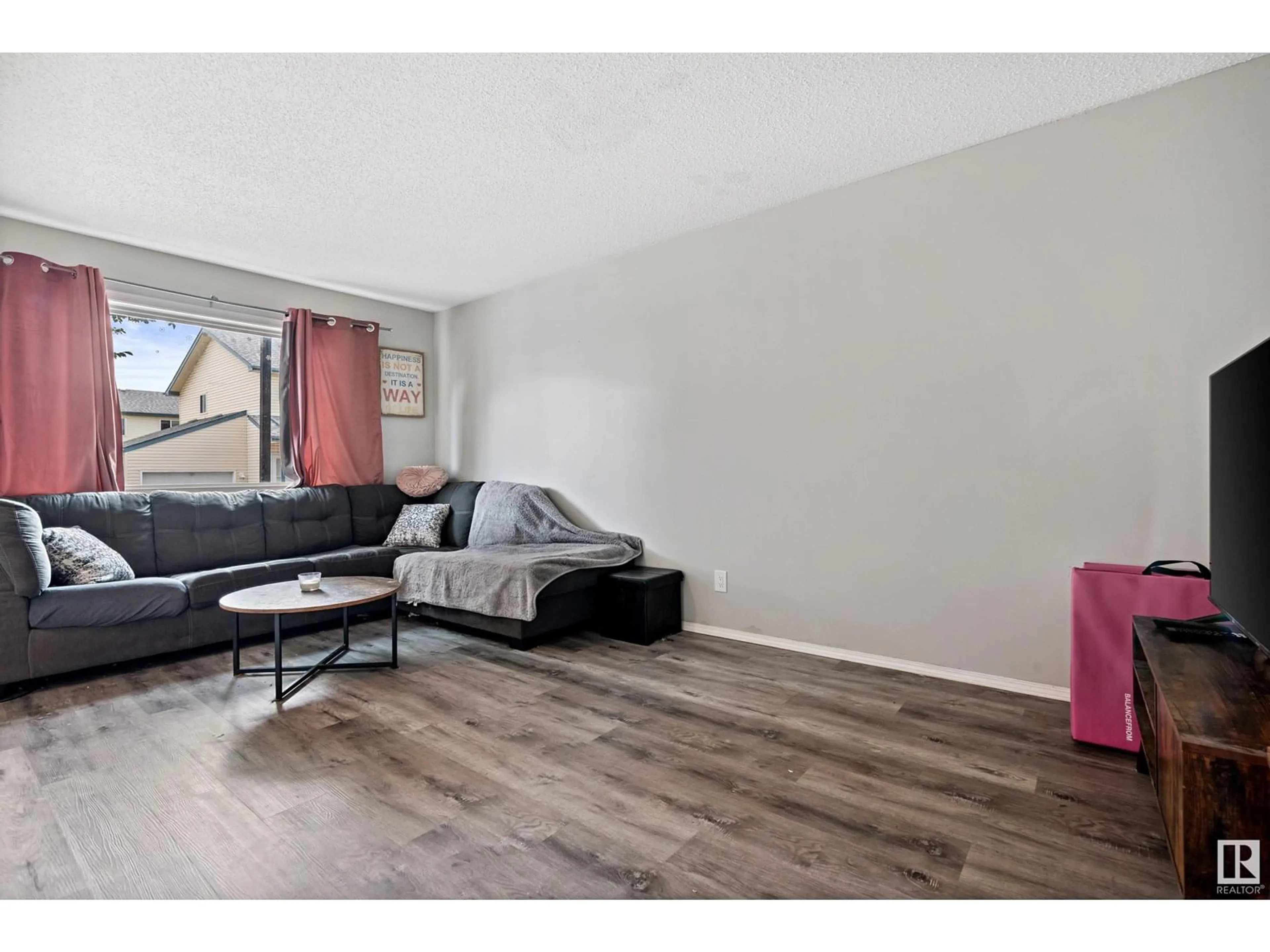Living room with furniture, wood/laminate floor for 42 - 10909 106 ST NW, Edmonton Alberta T5H4M7