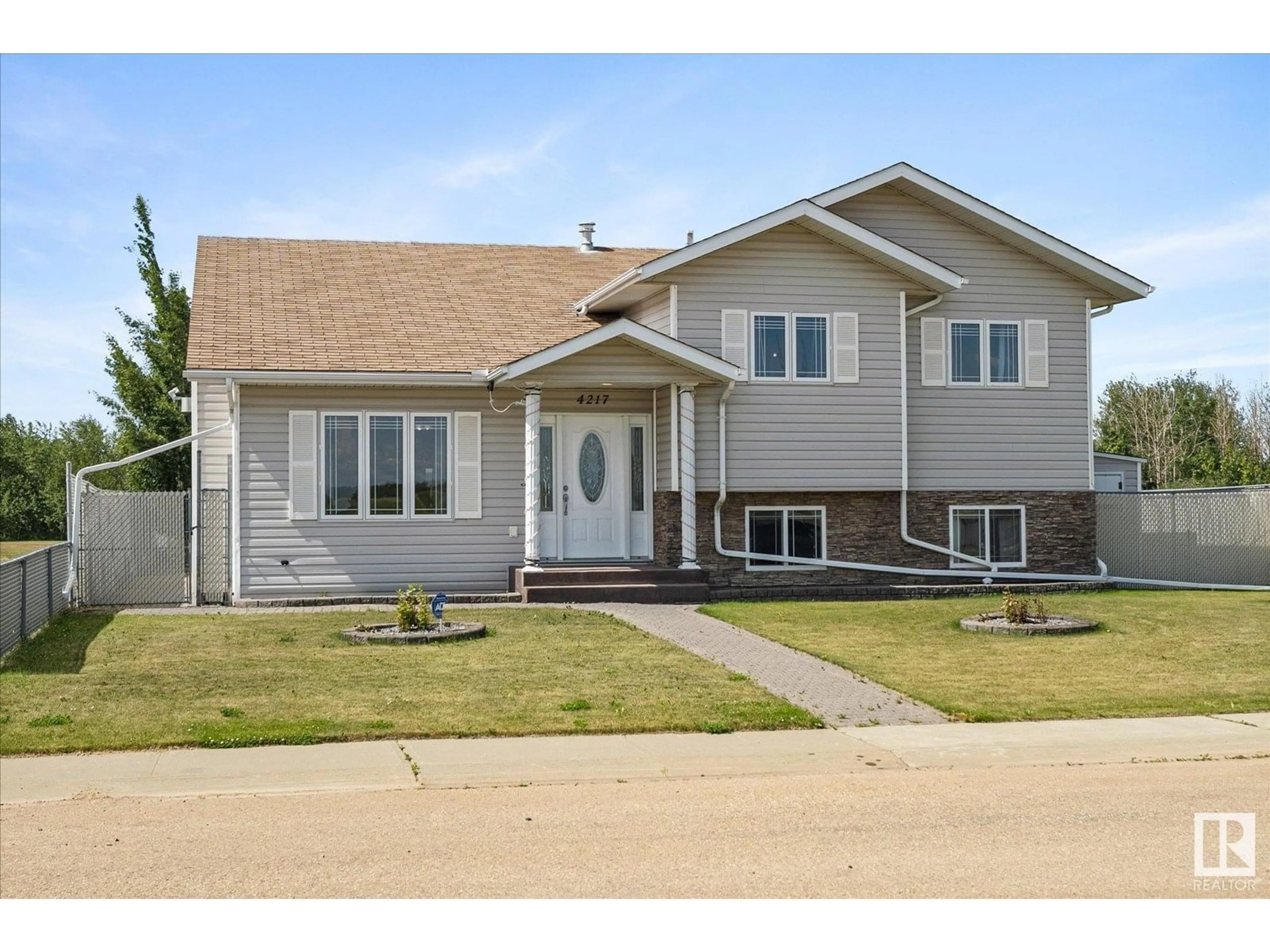 Home with vinyl exterior material, street for 4217 55 AV, Lamont Alberta T0B2R0