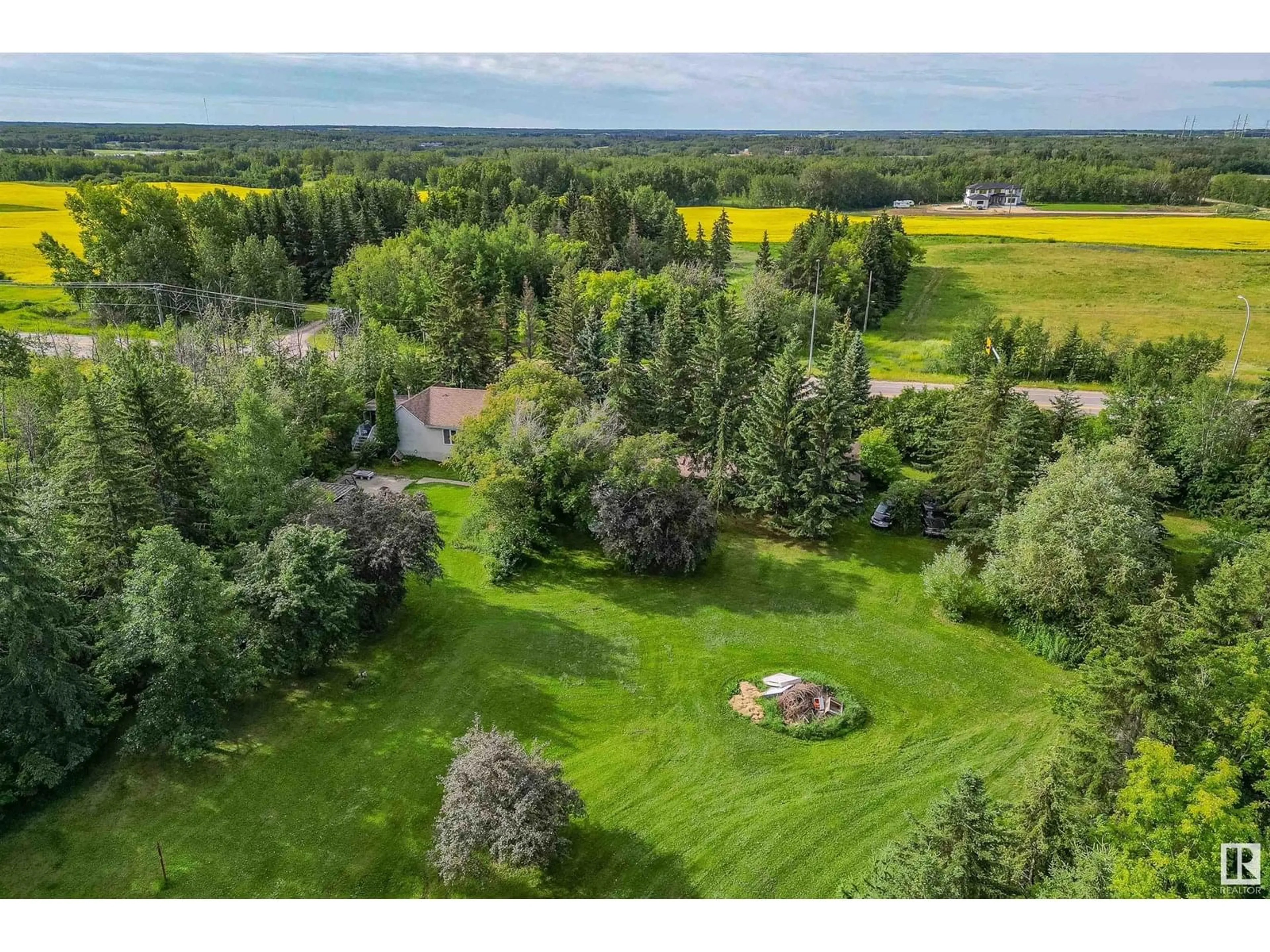 A pic from outside/outdoor area/front of a property/back of a property/a pic from drone, water/lake/river/ocean view for 23272 TWP ROAD 522, Rural Strathcona County Alberta T8B1H4