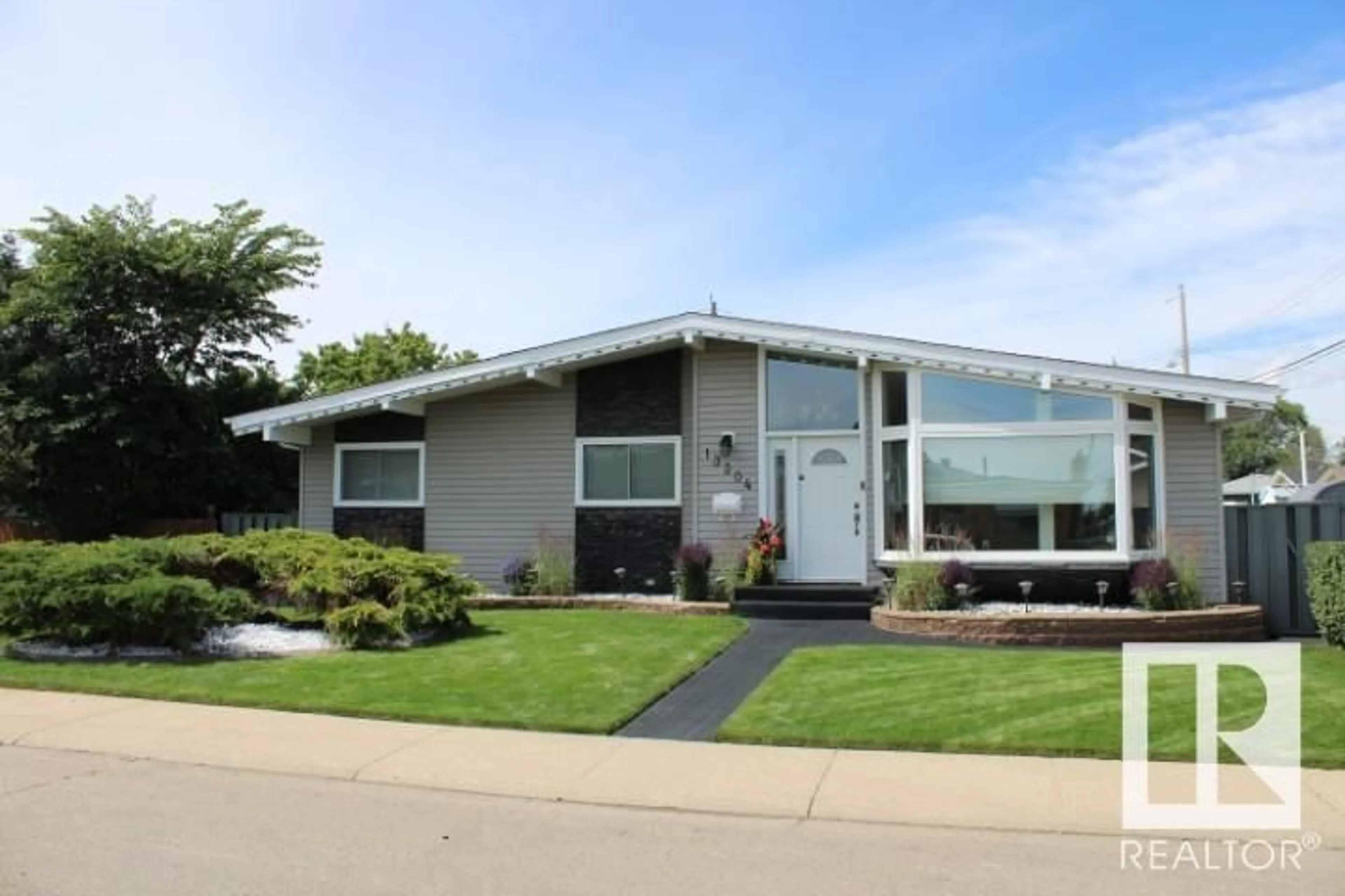 Home with vinyl exterior material, street for NW - 13304 70 ST, Edmonton Alberta T5C0K3