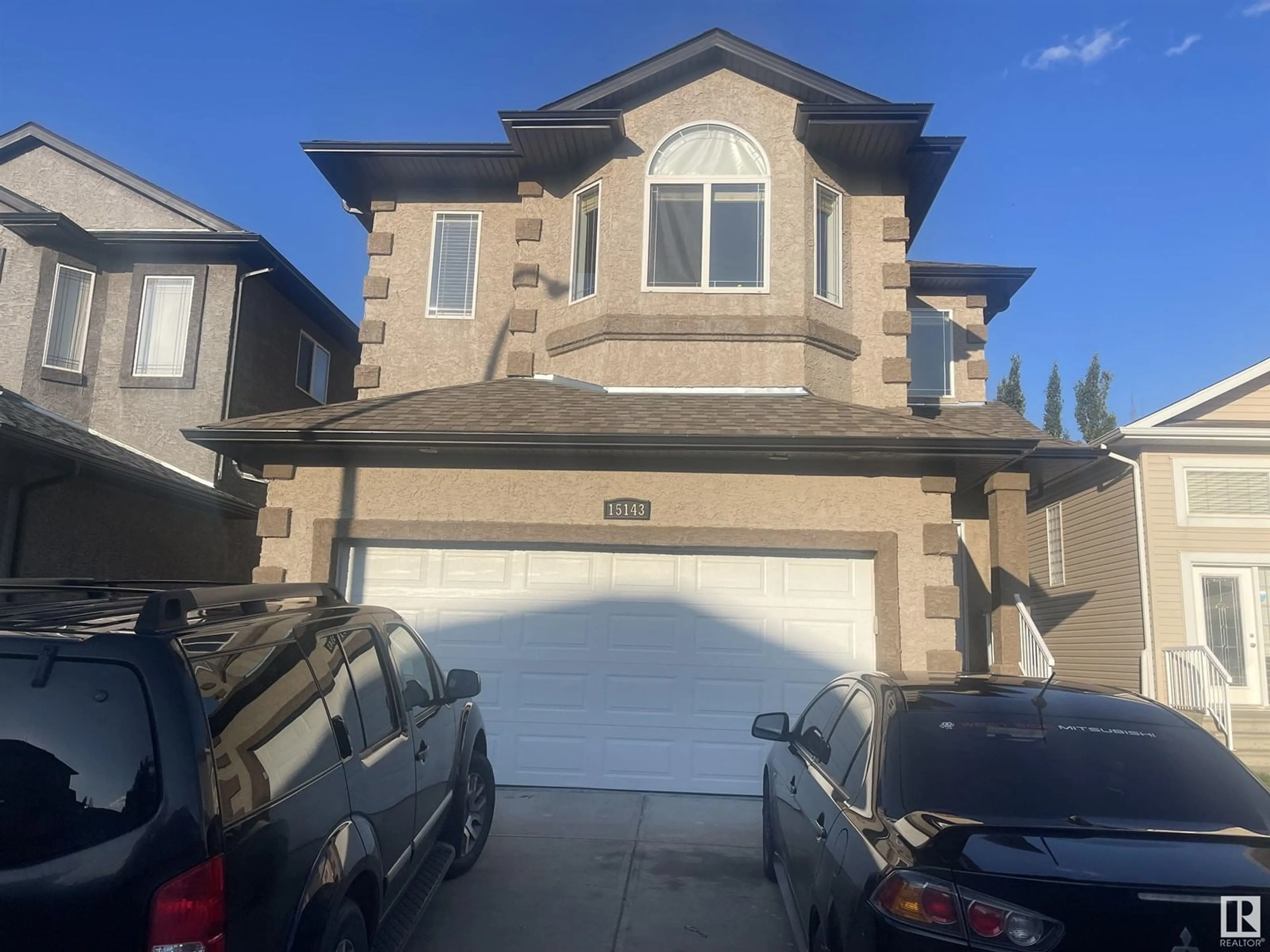 Home with vinyl exterior material, street for NW - 15143 32 ST, Edmonton Alberta T5Y0M3
