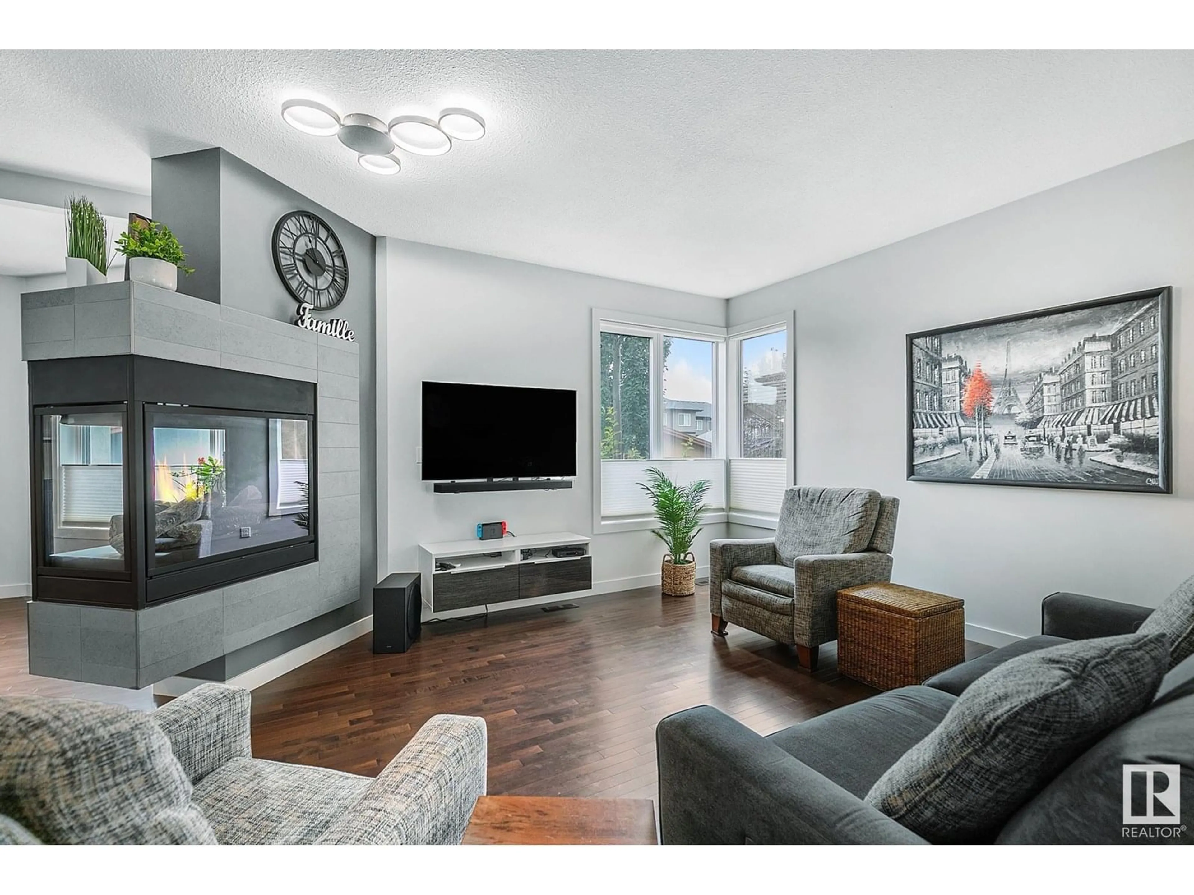 Living room with furniture, wood/laminate floor for 314 MAGRATH BV, Edmonton Alberta T6R0M7