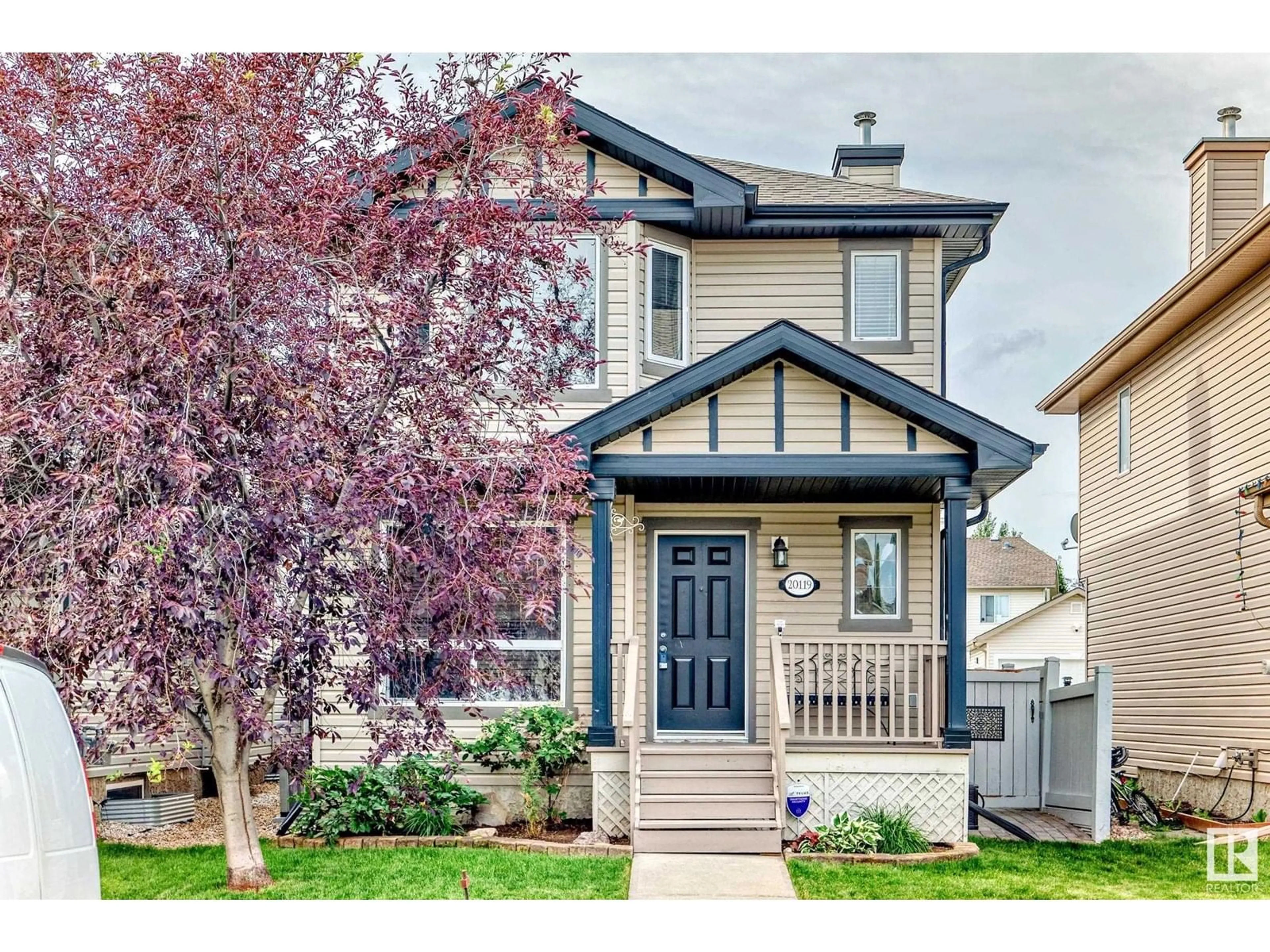 Home with vinyl exterior material, street for NW - 20119 58 AV, Edmonton Alberta T6M0B5