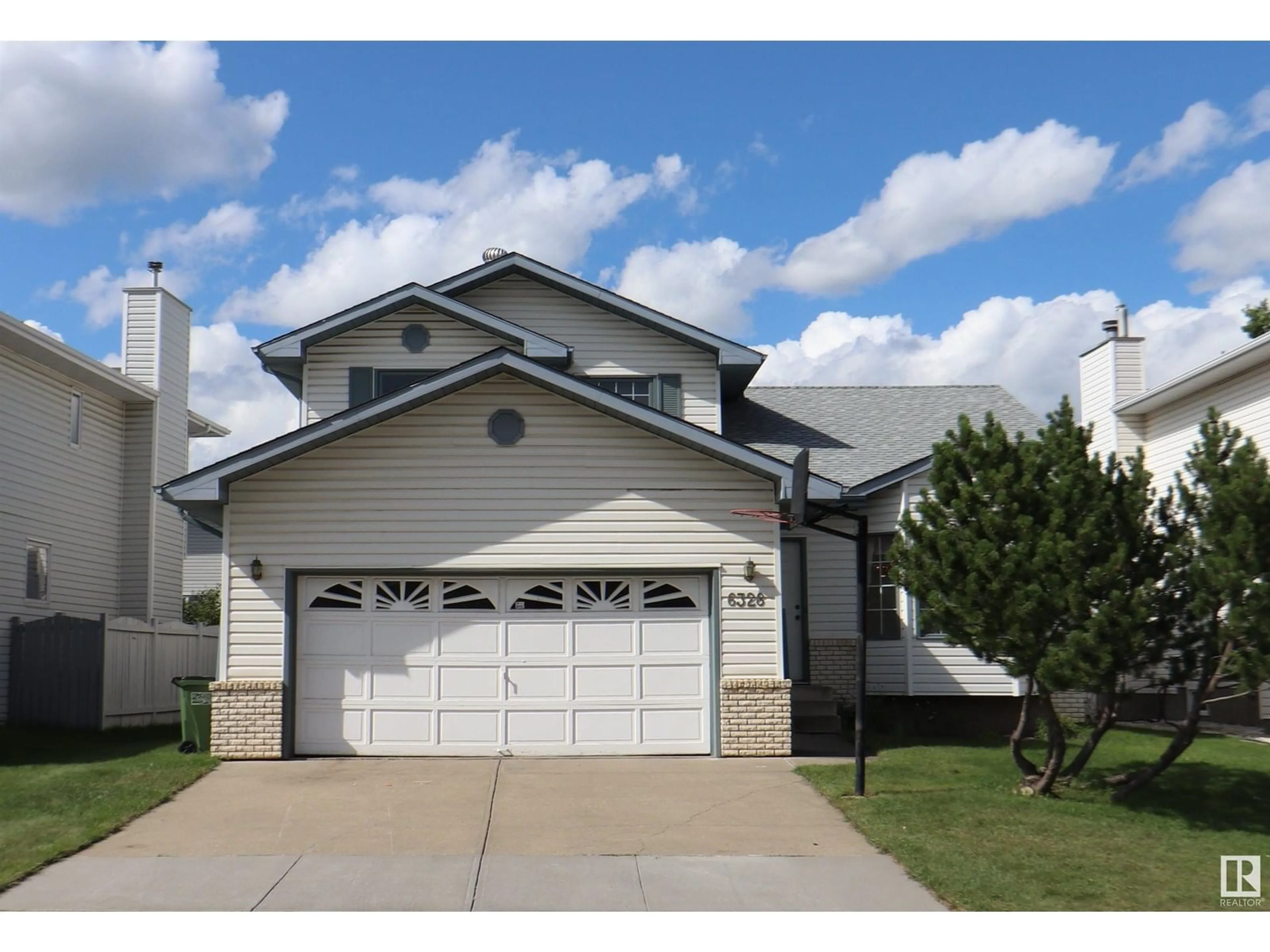 Home with vinyl exterior material, street for 6328 160 AV, Edmonton Alberta T5Y2P9